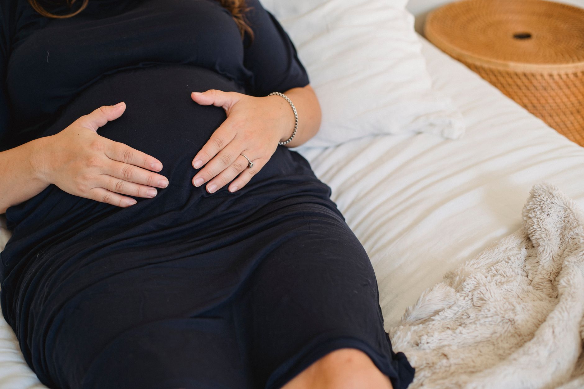 Pregnant woman's hands on belly