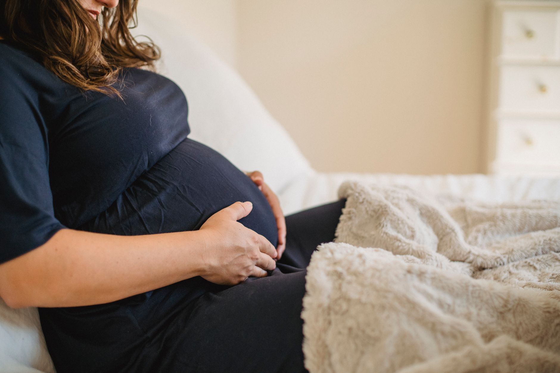 Hand on pregnant belly