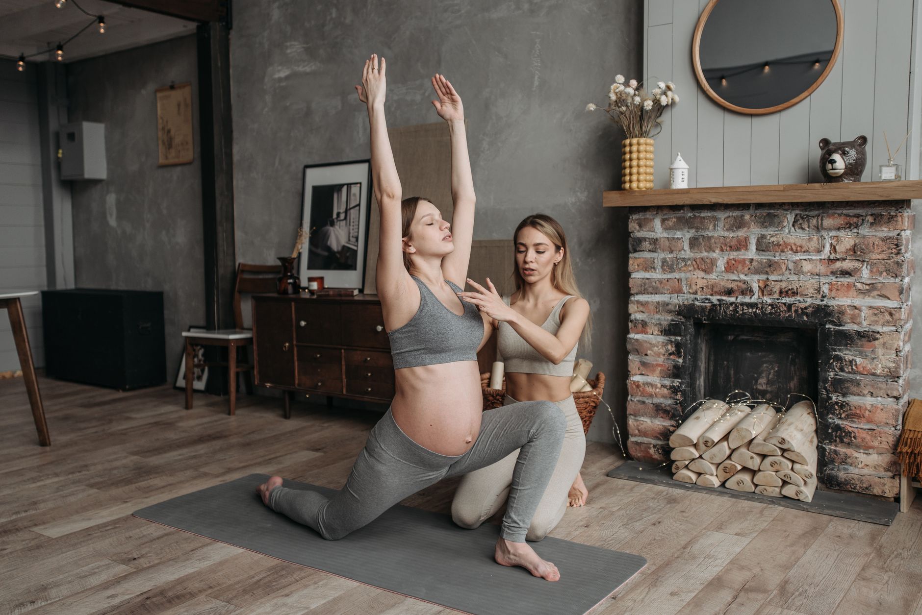 Pregnant woman performing pelvic tilts