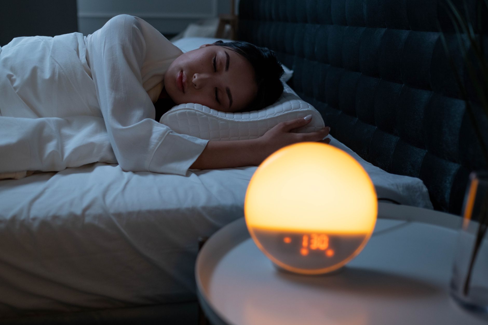 Pregnant person sleeping on left side