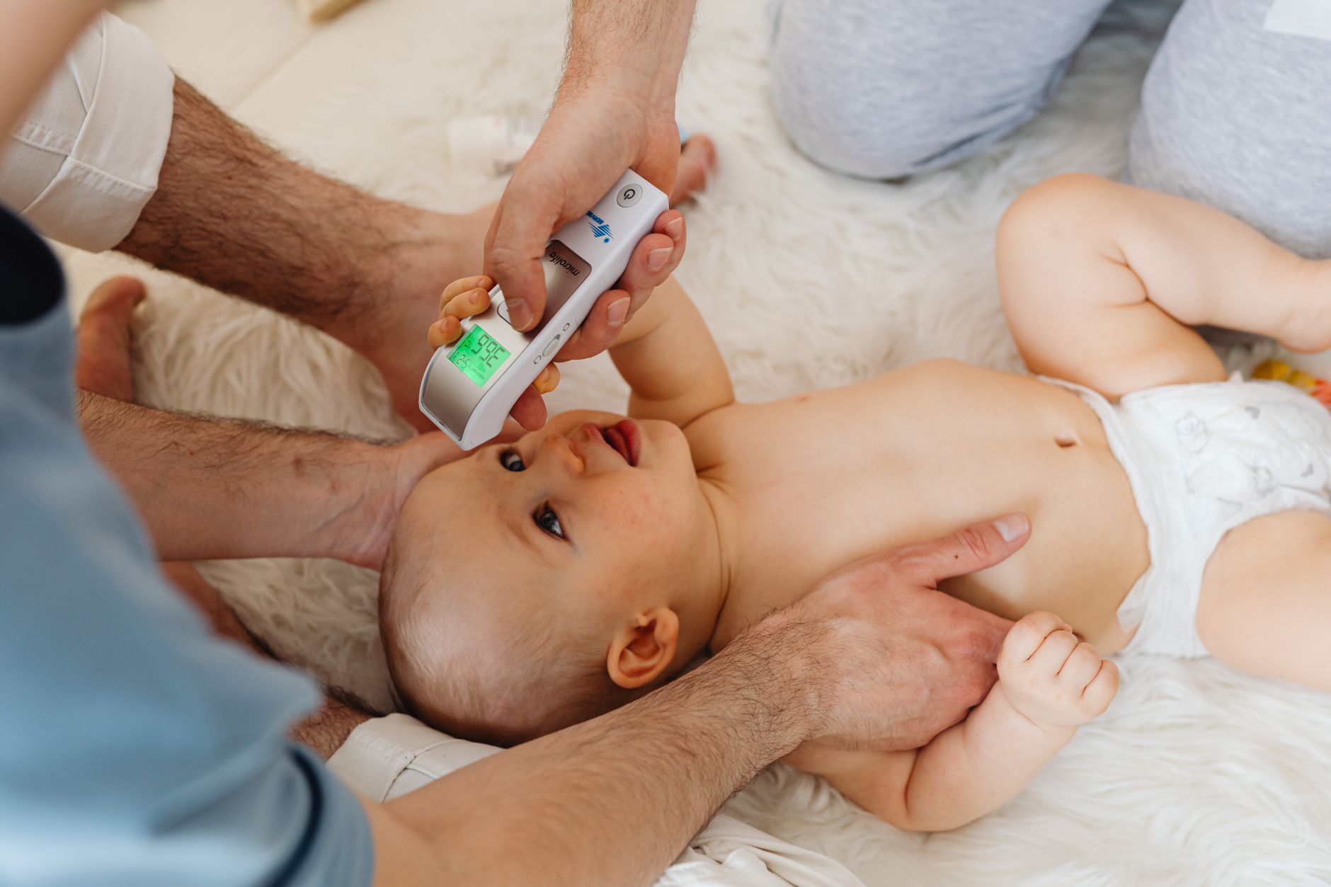 Parent monitoring infant temperature after vaccination