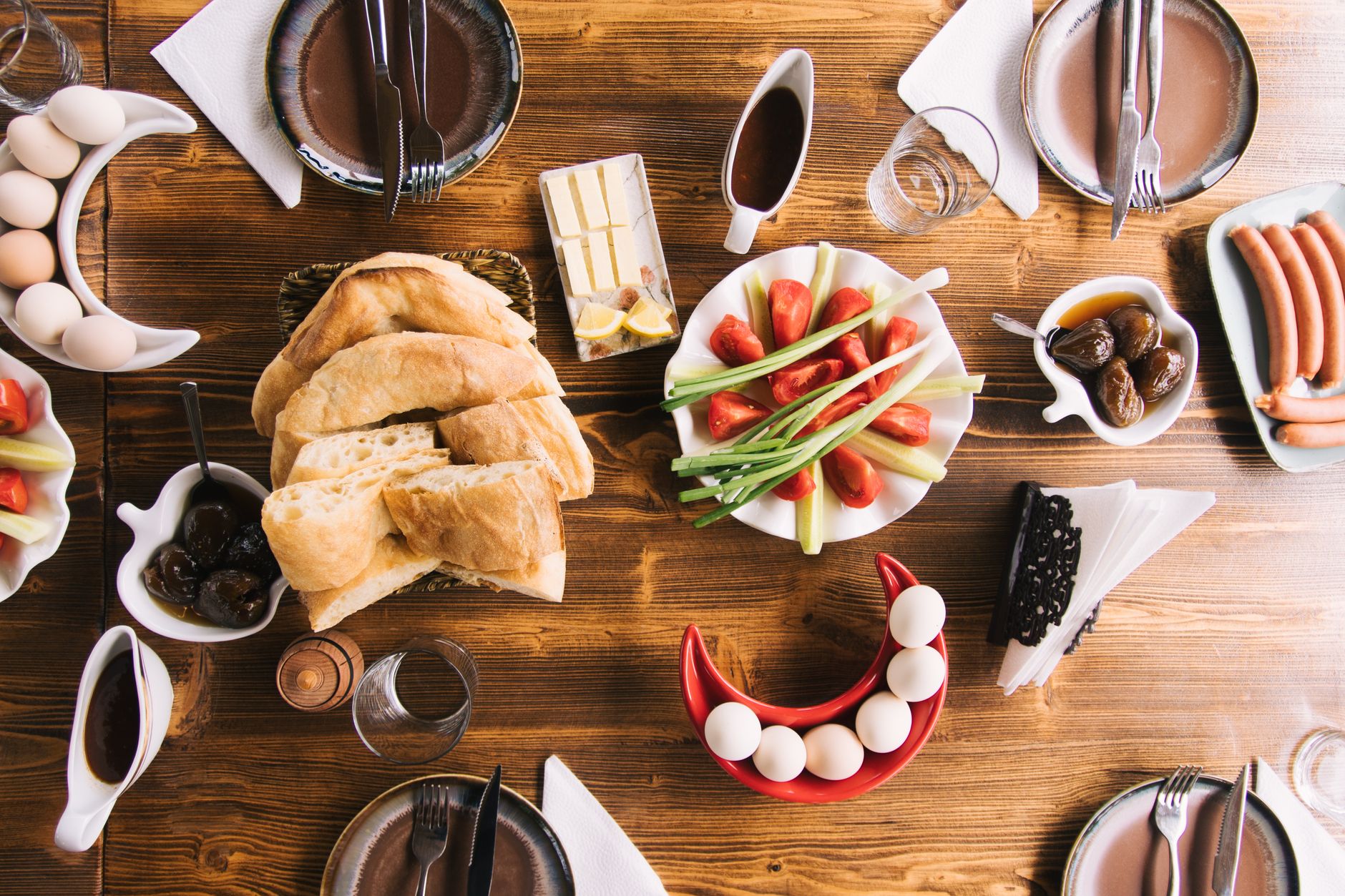 Close-up of a balanced plate with milk, broccoli, salmon, and whole grain toast, bright kitchen lighting, natural wood table