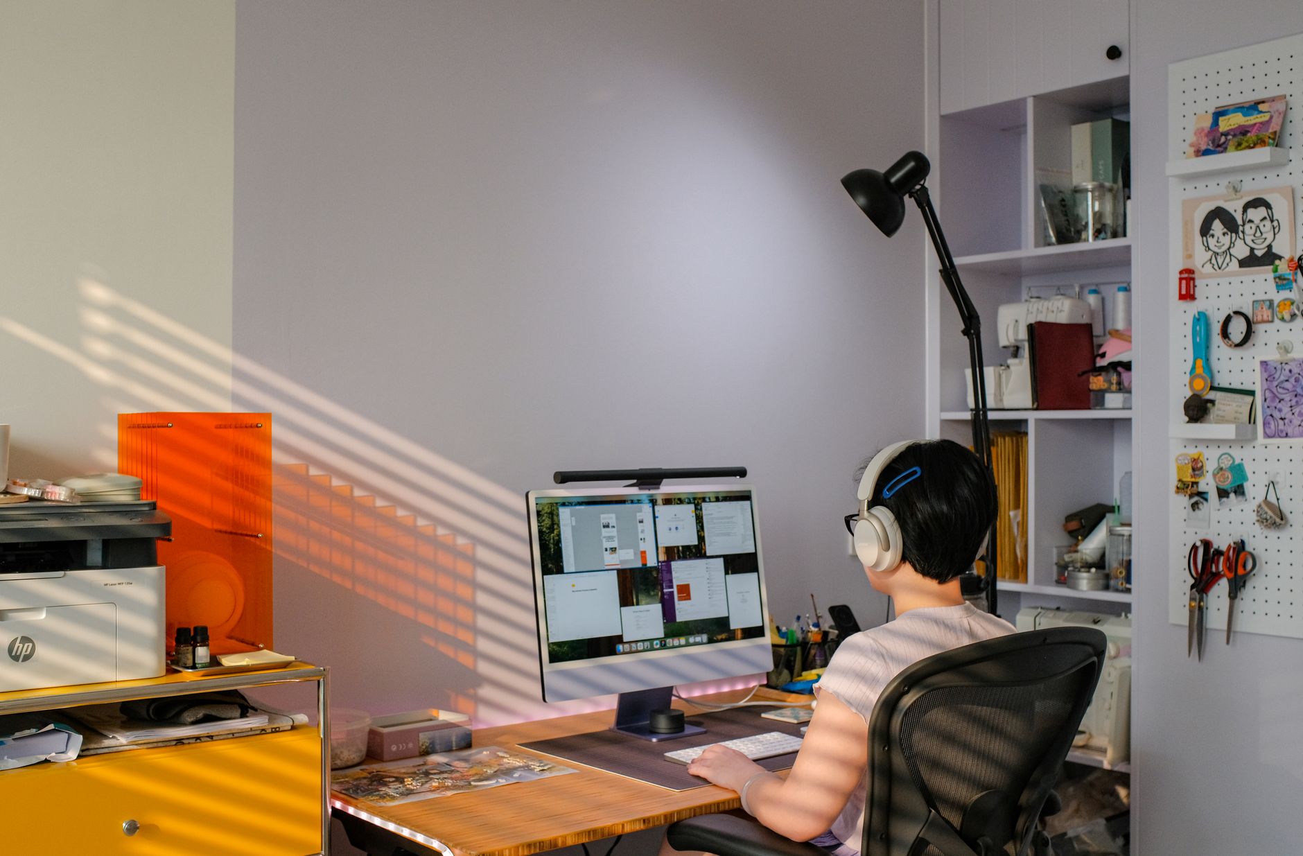 Pregnant woman at an ergonomic desk setup