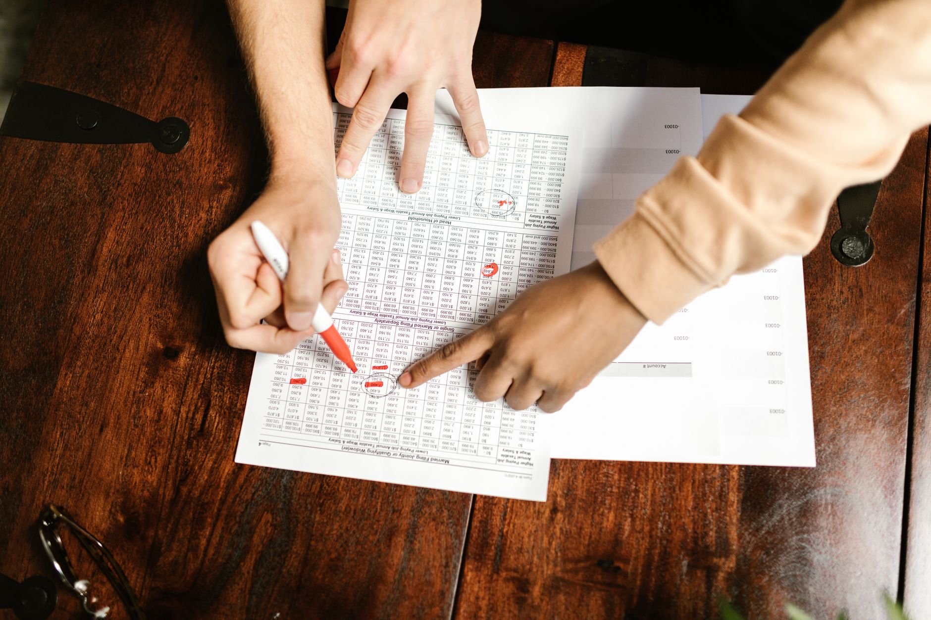 Couple budgeting with a baby monitor