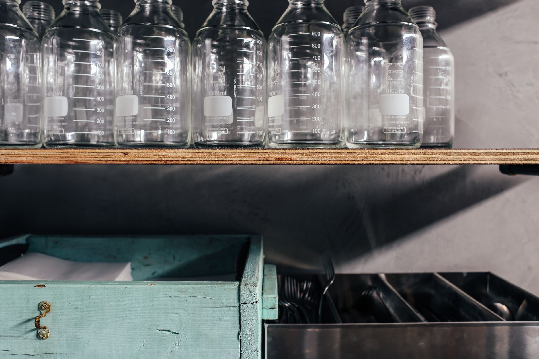 Spring water bottles beside formula prep area