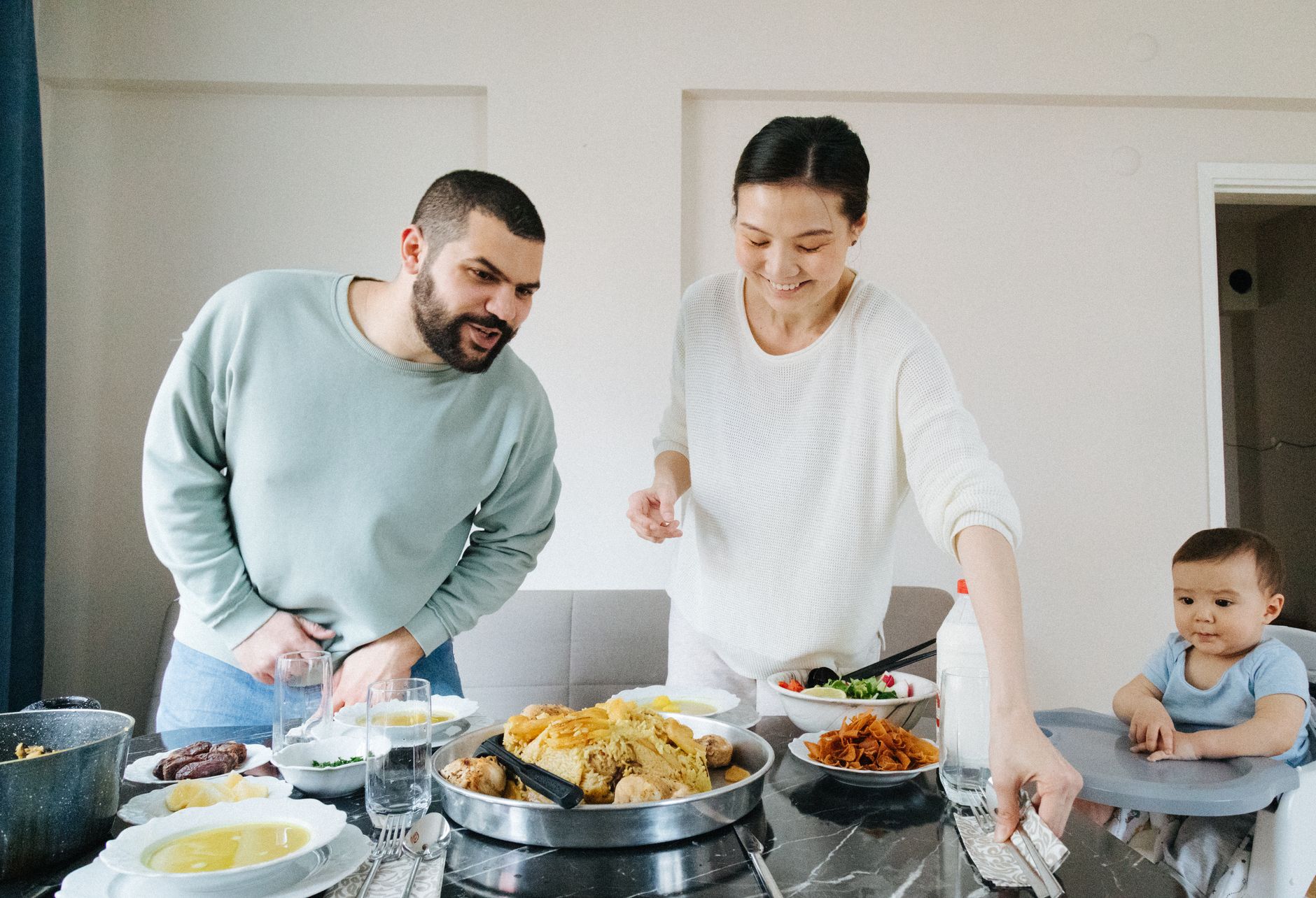 Co-parents planning together with a baby in a carrier