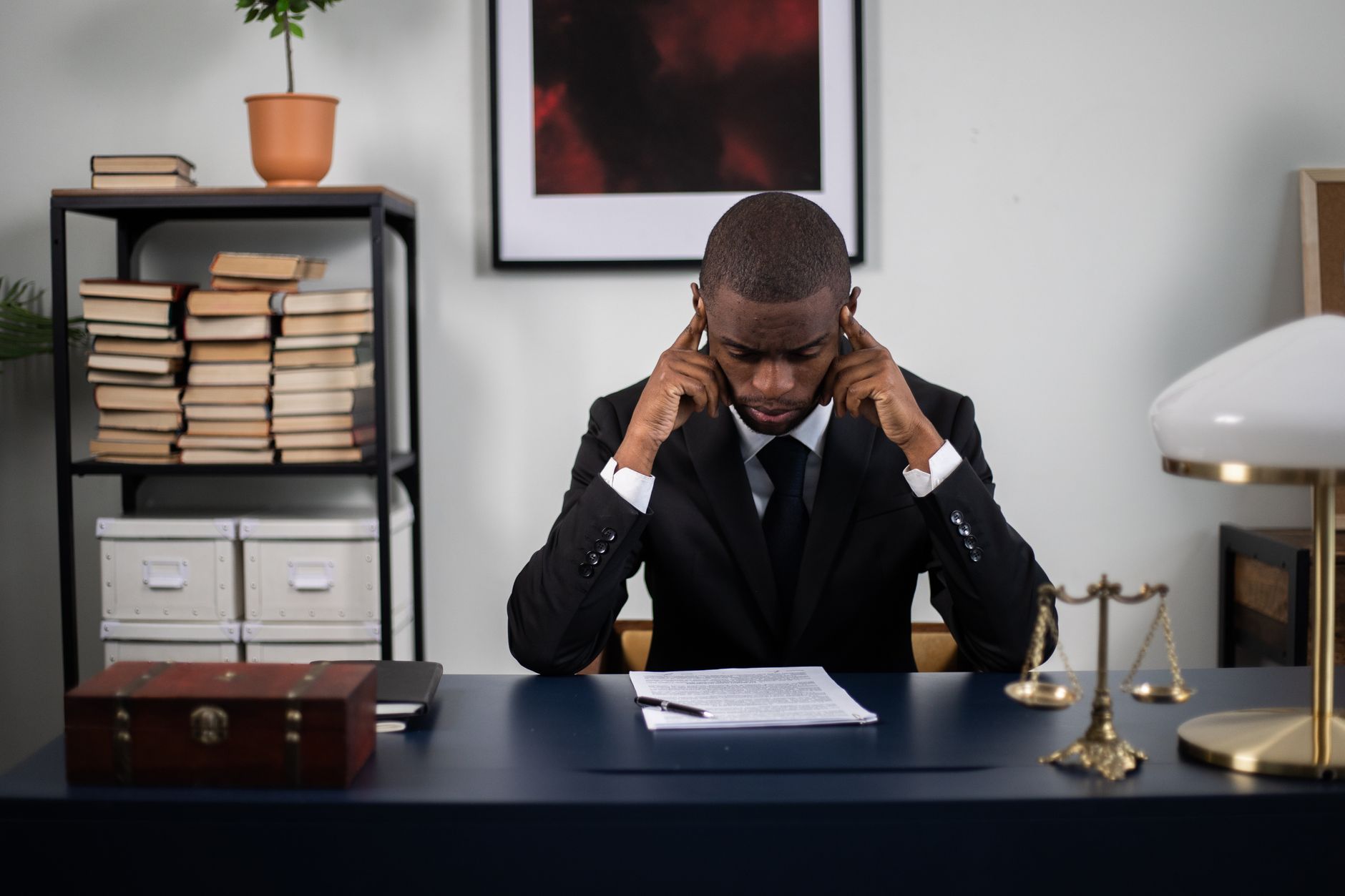 A neatly organized stack of legal books and official documents resting on a polished wooden desk, representing the importance of understanding legal rights and responsibilities in the context of coparenting after divorce.