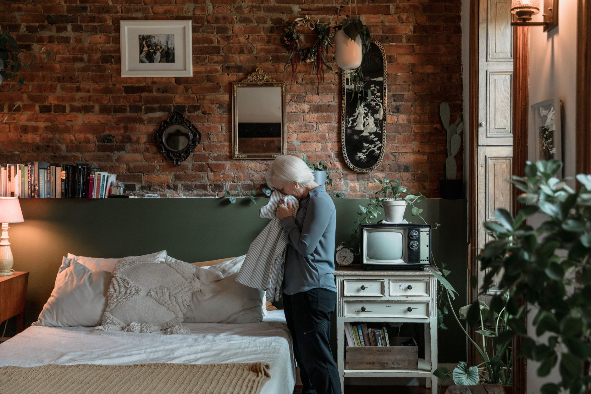 Bedroom with journal and plant for mental health reflection