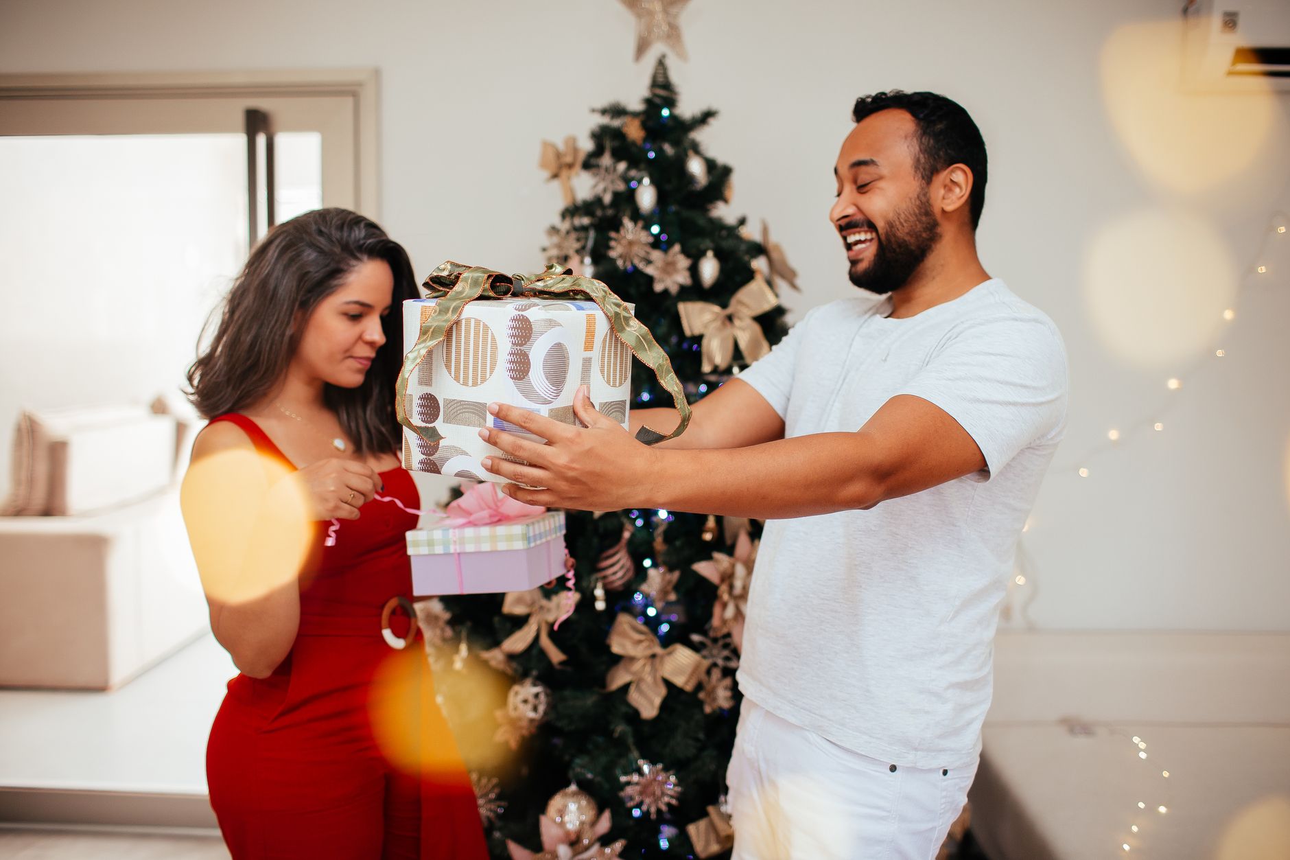 A family laughing over holiday gifts.