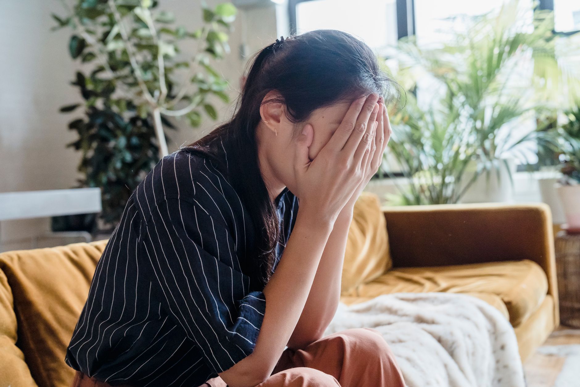A woman reflecting on holiday grief support.
