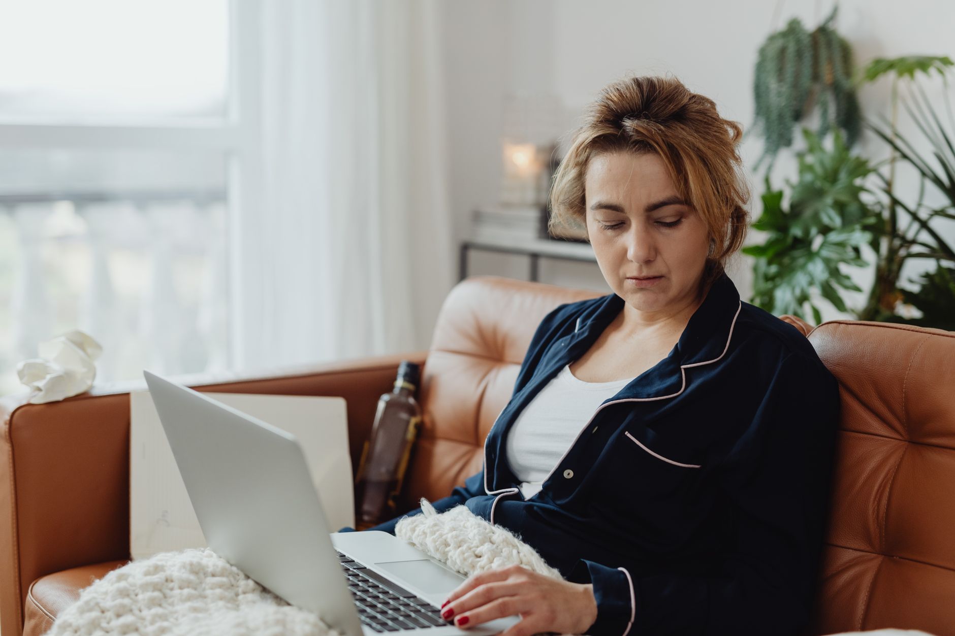 A woman researching holiday mental health resources.
