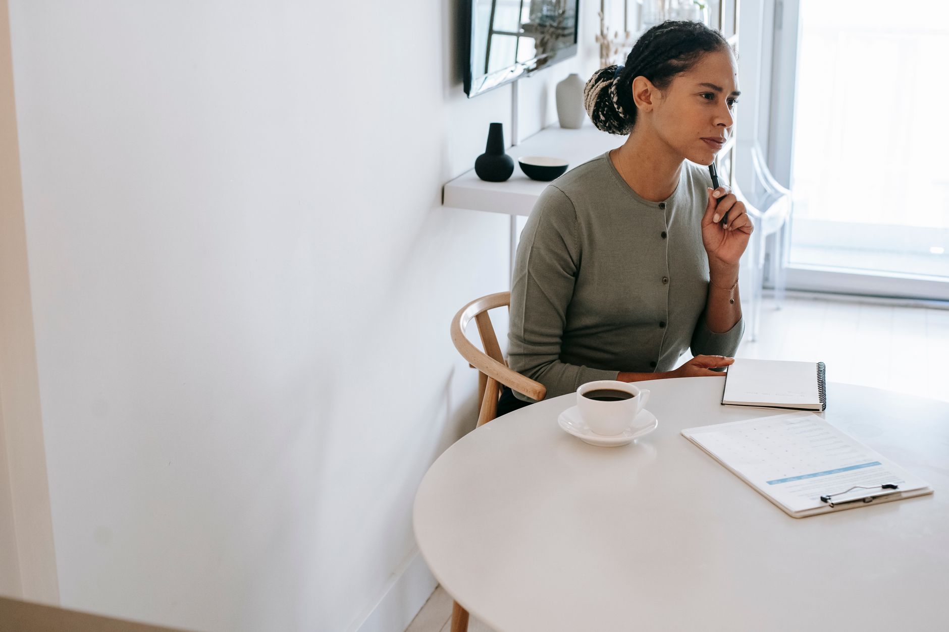 A woman reviewing references for holiday support.