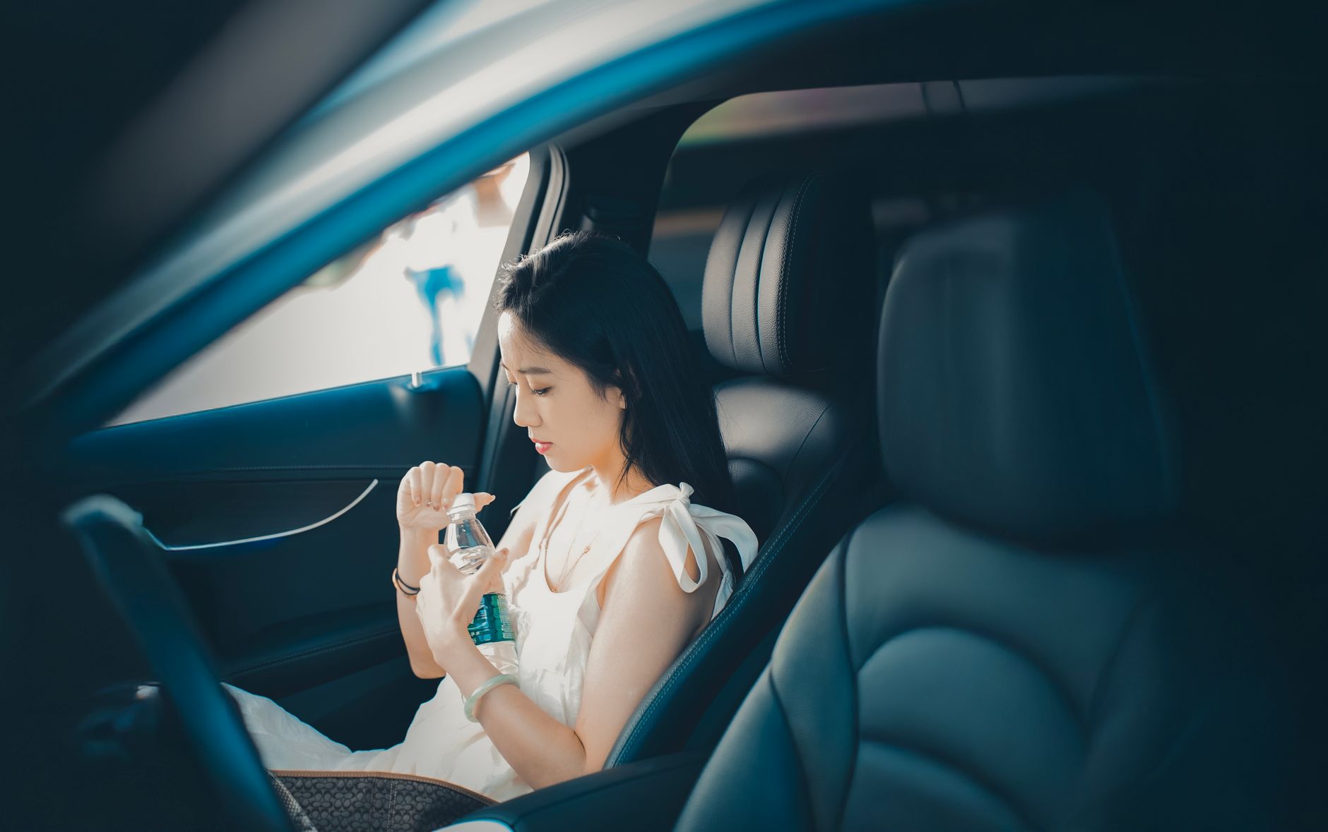 Pregnant driver staying hydrated