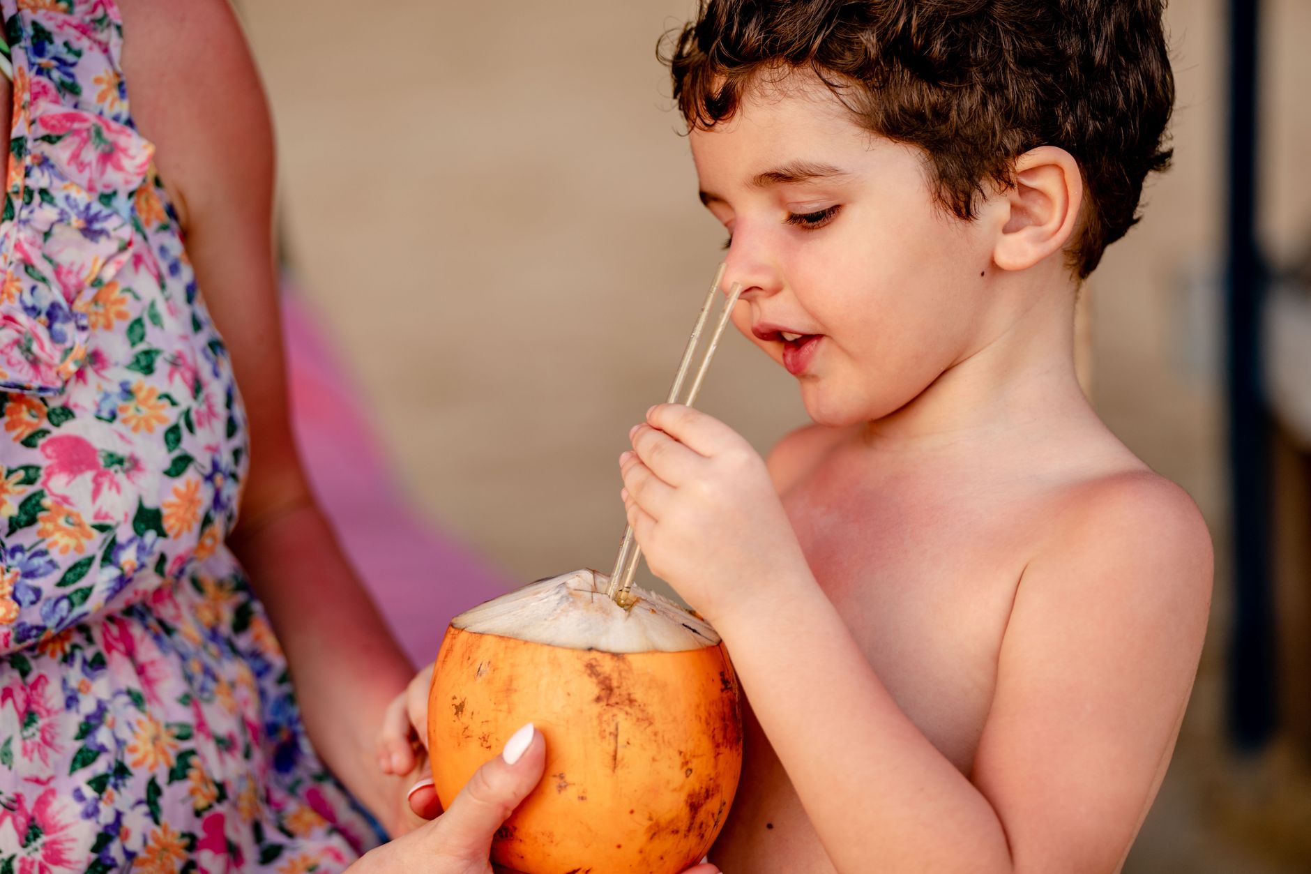 Toddler choosing between juice and water