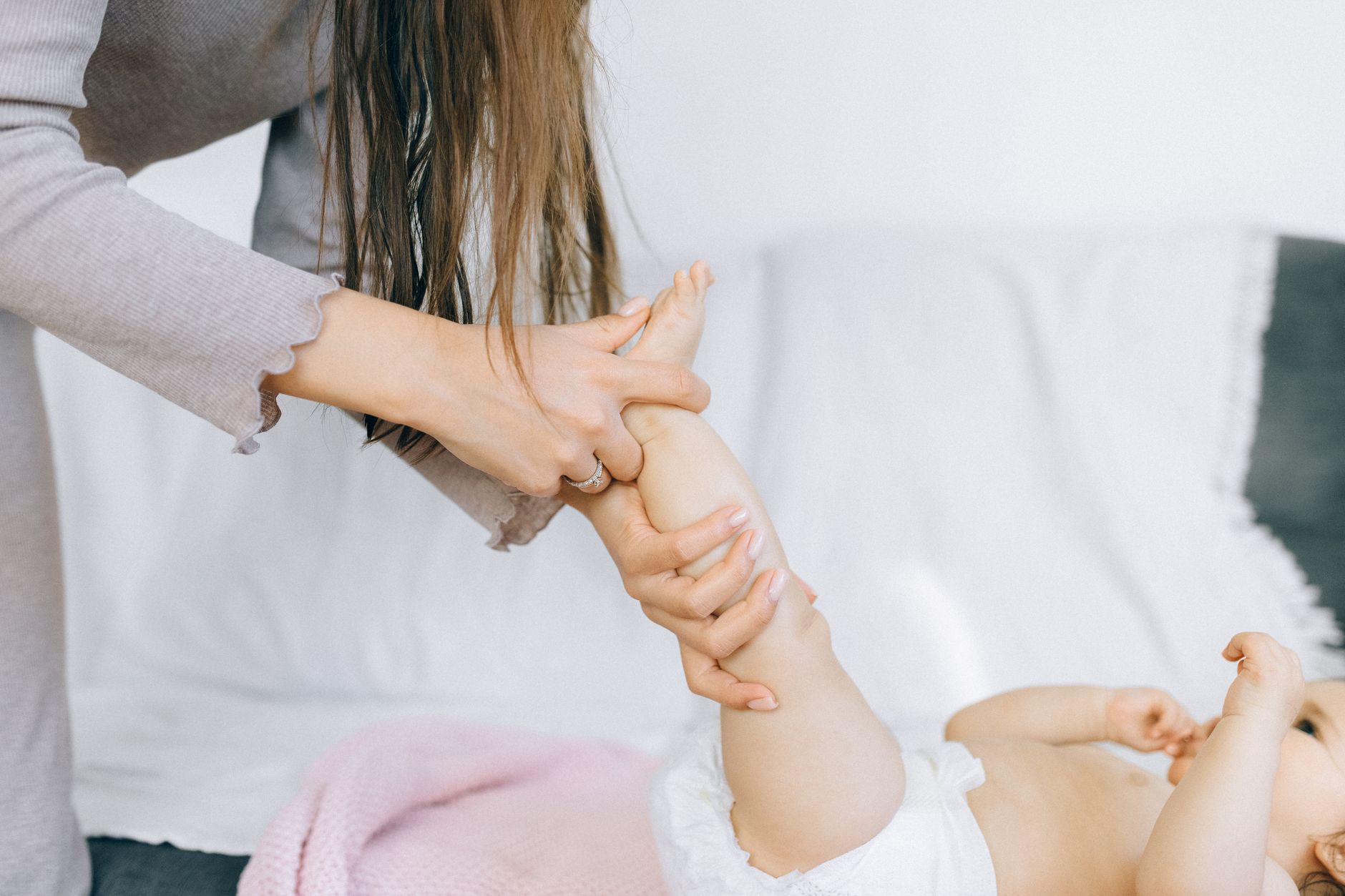Warm water belly massage for infant constipation