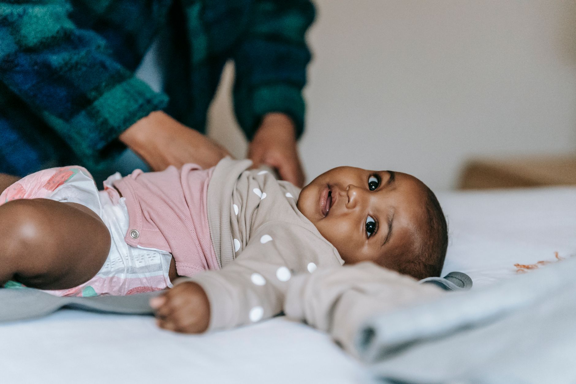 Parent checking baby's stool color after iron supplement