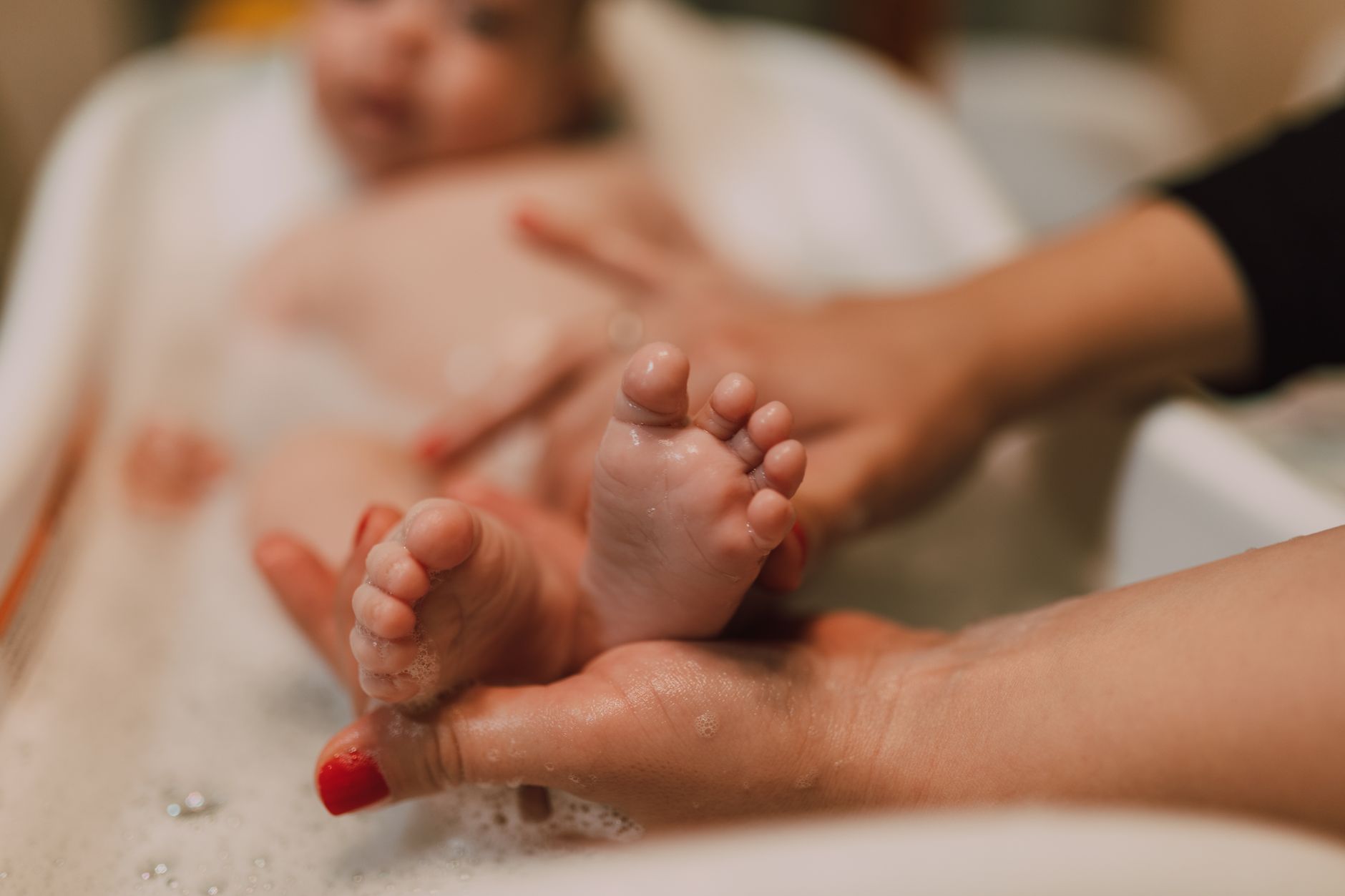Baby holding a safe bath toy