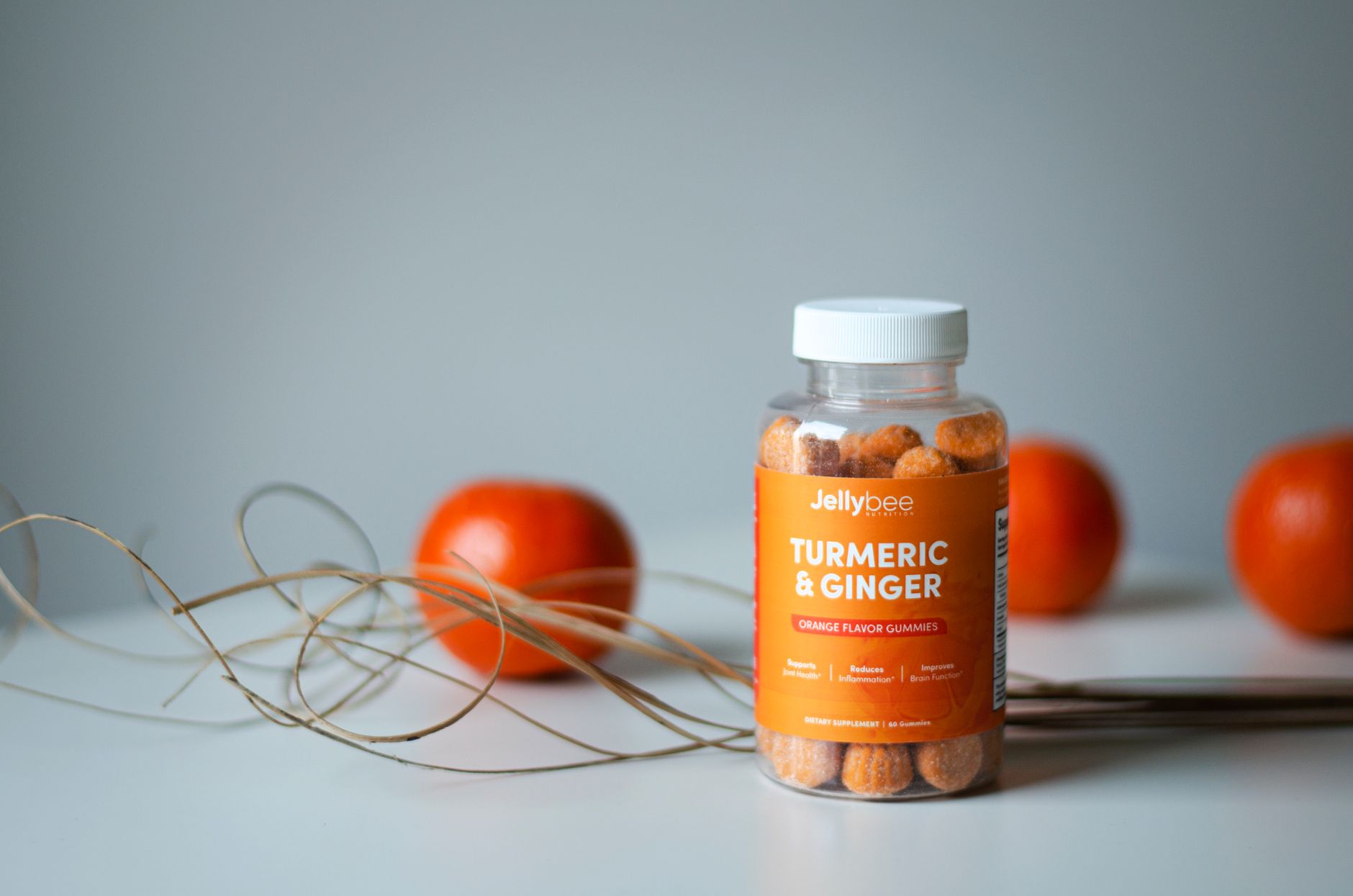Pregnancy-safe immune-boosting foods like oranges, ginger, and leafy greens arranged on a kitchen counter