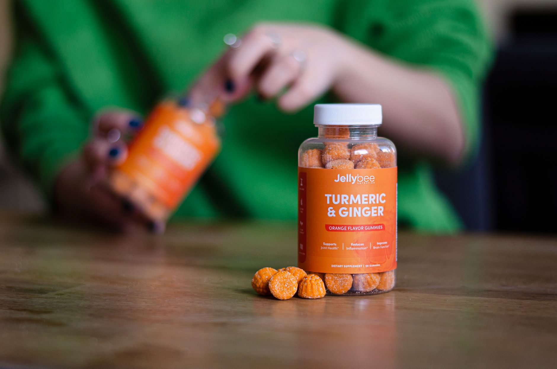 a collection of ginger capsules, a vitamin B6 bottle, and a peppermint tea cup on a wooden table, bright natural light, inviting composition
