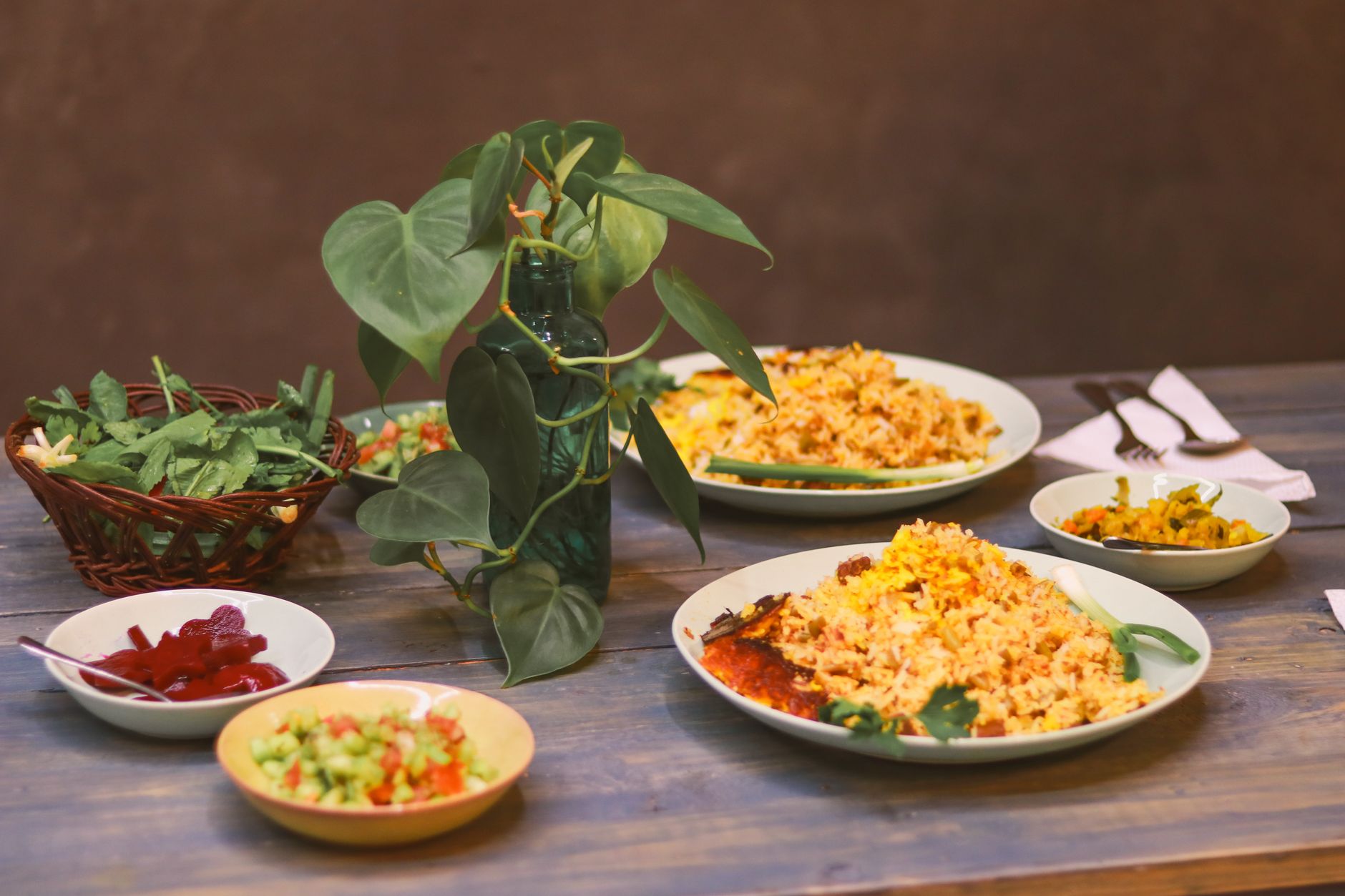 A comparison of two fast-casual restaurant rice bowls side-by-side: one from Chipotle and one from Qdoba, highlighting their differences in toppings and presentation.
