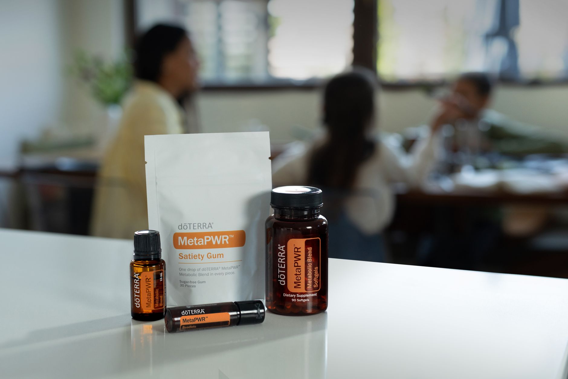 A neatly arranged collection of herbal teas and supplement bottles on a wooden countertop, soft daylight highlighting the labels, evoking a calm prenatal wellness routine.