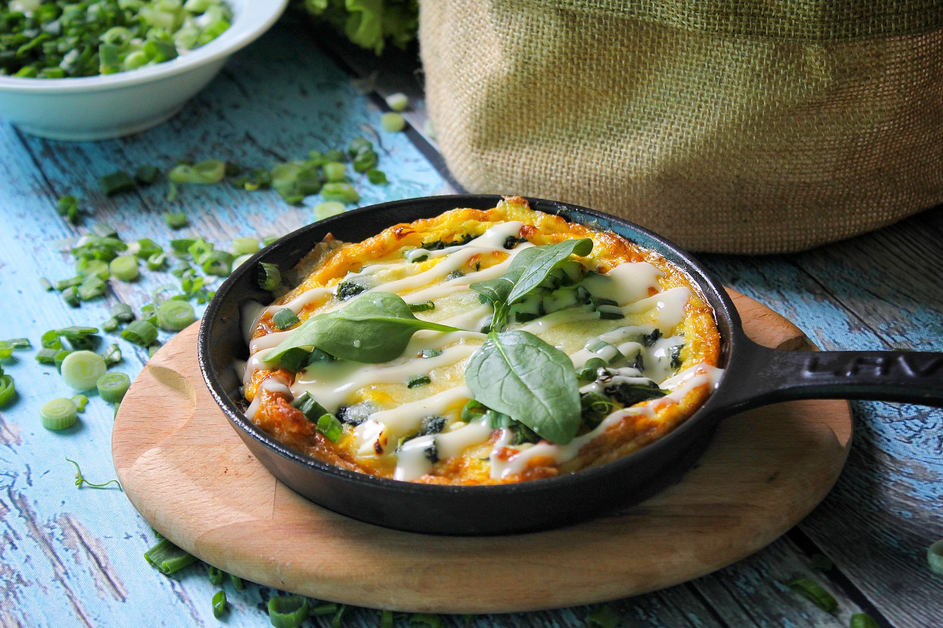 bright kitchen counter displaying a skillet with fully cooked scrambled eggs, fresh spinach, and a side of whole grain toast, emphasizing safe cooking methods for pregnant women