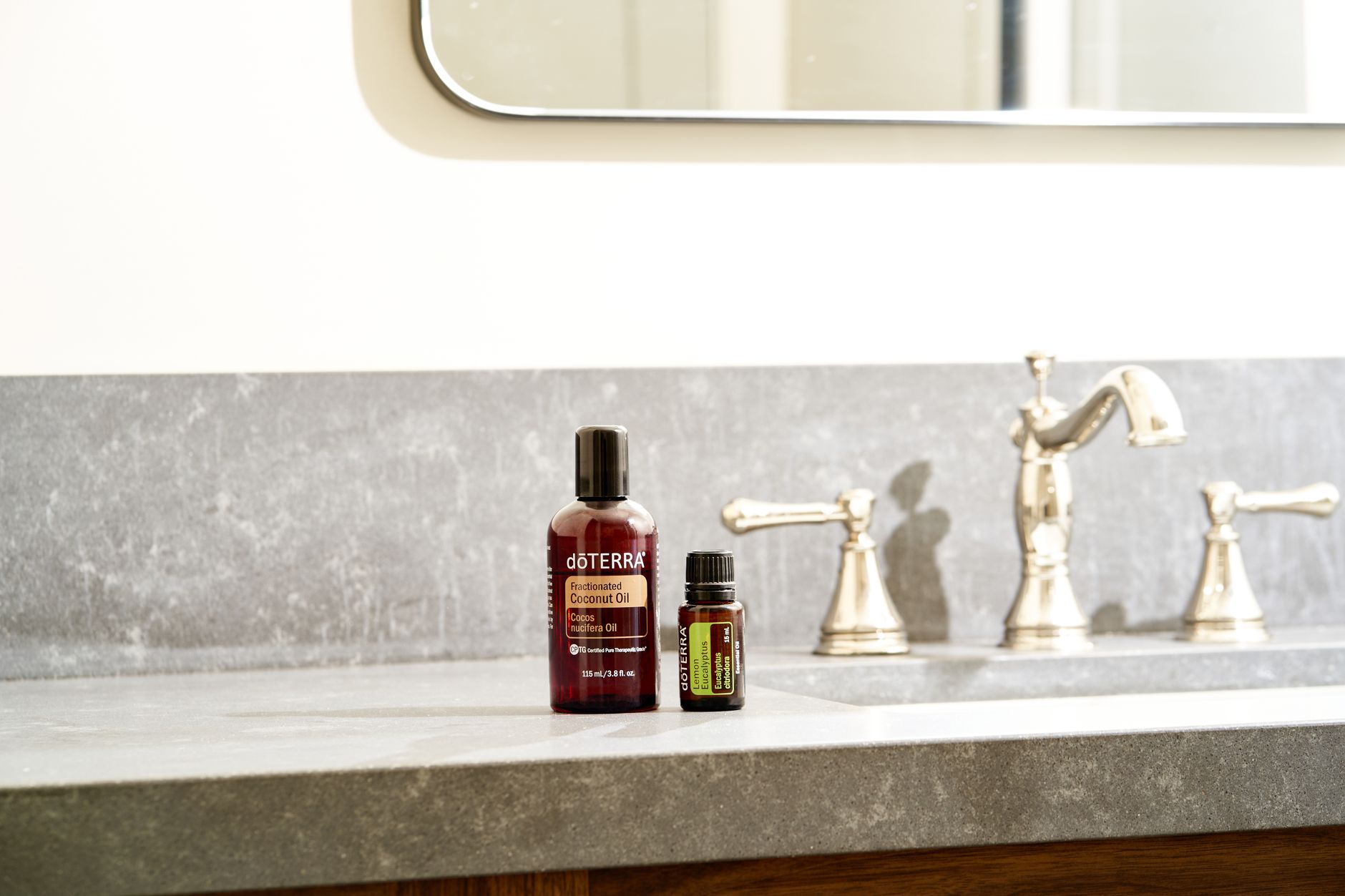 A bright, organized bathroom counter holding a bottle of witch hazel pads, a small sitz bath basin, a jar of aloe vera gel, and a container of fiber supplement, showcasing a natural, pregnancy‑friendly hemorrhoid relief kit