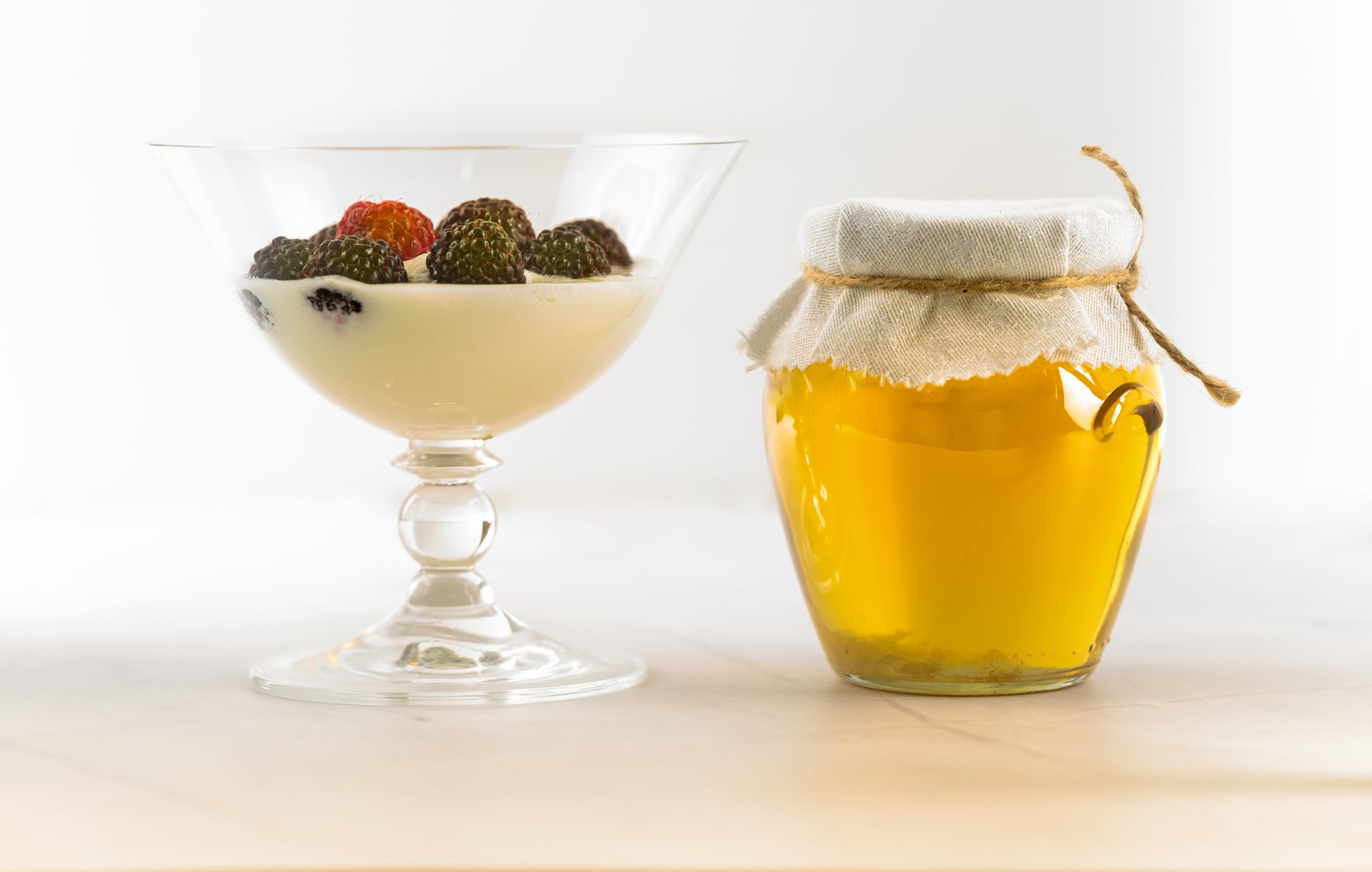 a selection of pregnancy‑safe chocolate alternatives—dark chocolate squares, fresh berries, and a bowl of Greek yogurt with honey—arranged on a wooden board with soft natural lighting