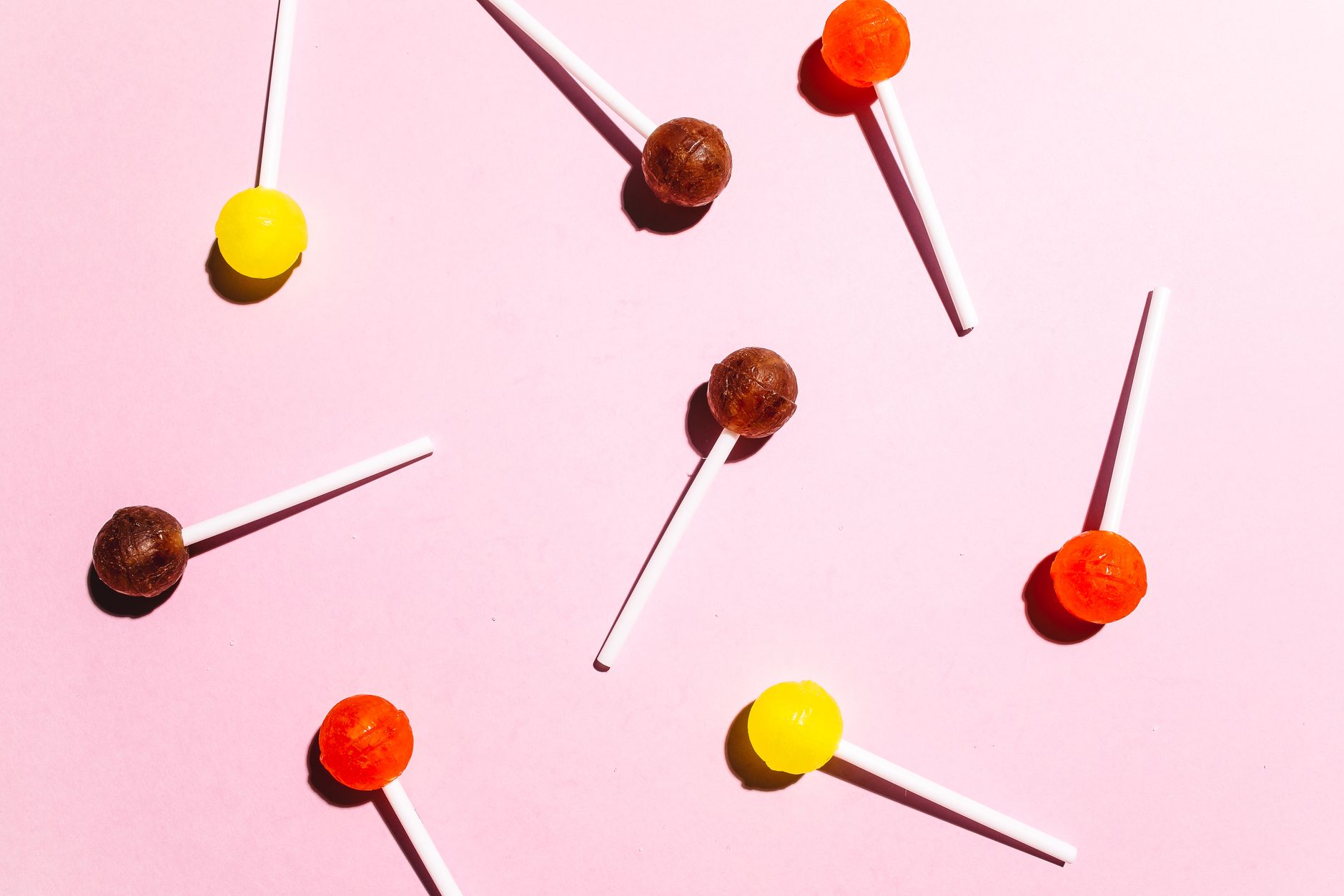 a variety of pregnancy‑safe candy alternatives displayed on a pastel tray, including dried fruit, ginger snaps, honey sticks, and anise candy, bright natural lighting