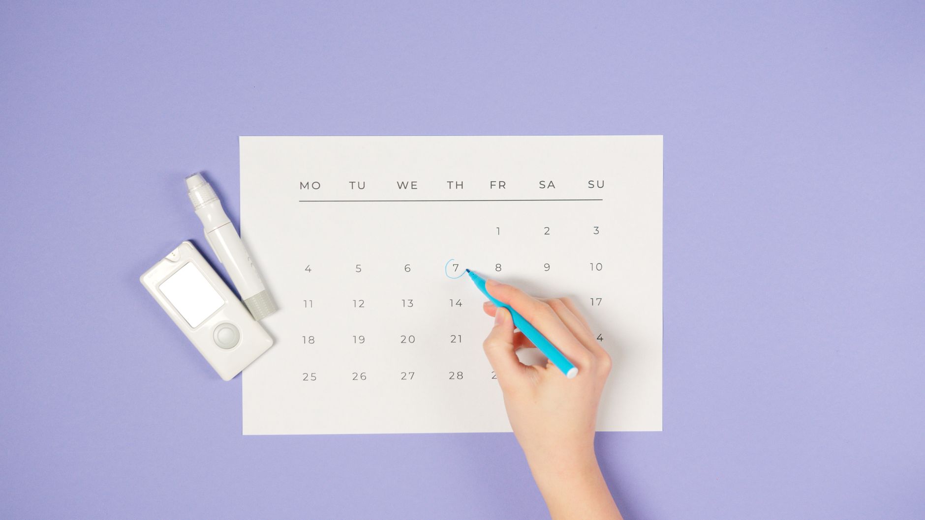 A tidy bathroom shelf displaying a Lovenox prefilled syringe, a labeled insulin pen, and a small calendar reminder for medication timing, illustrating organized home medication management for pregnant patients