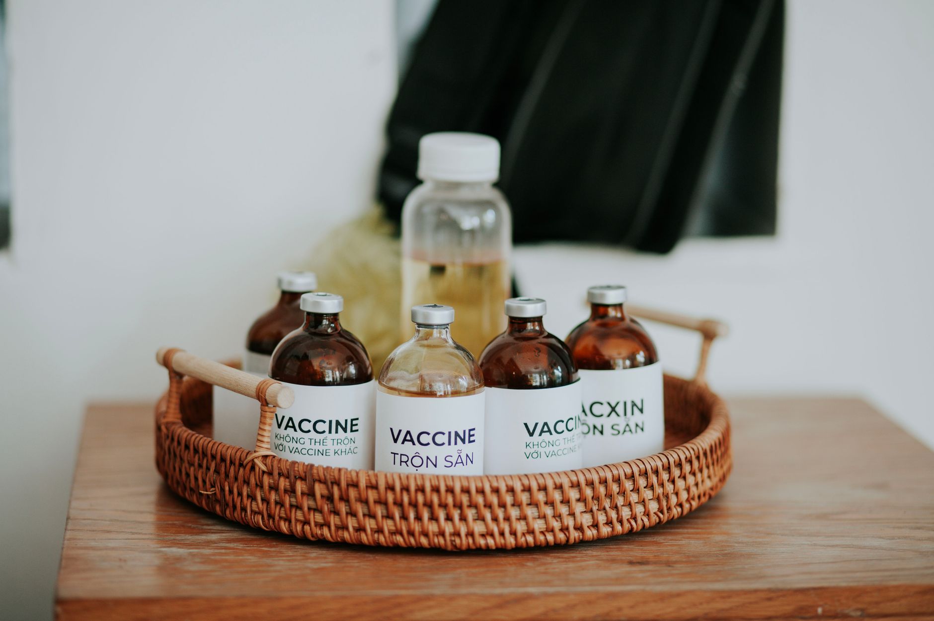A collection of pregnancy‑safe lubricants displayed on a wooden tray, each bottle labeled clearly, bright natural lighting highlighting the variety of options