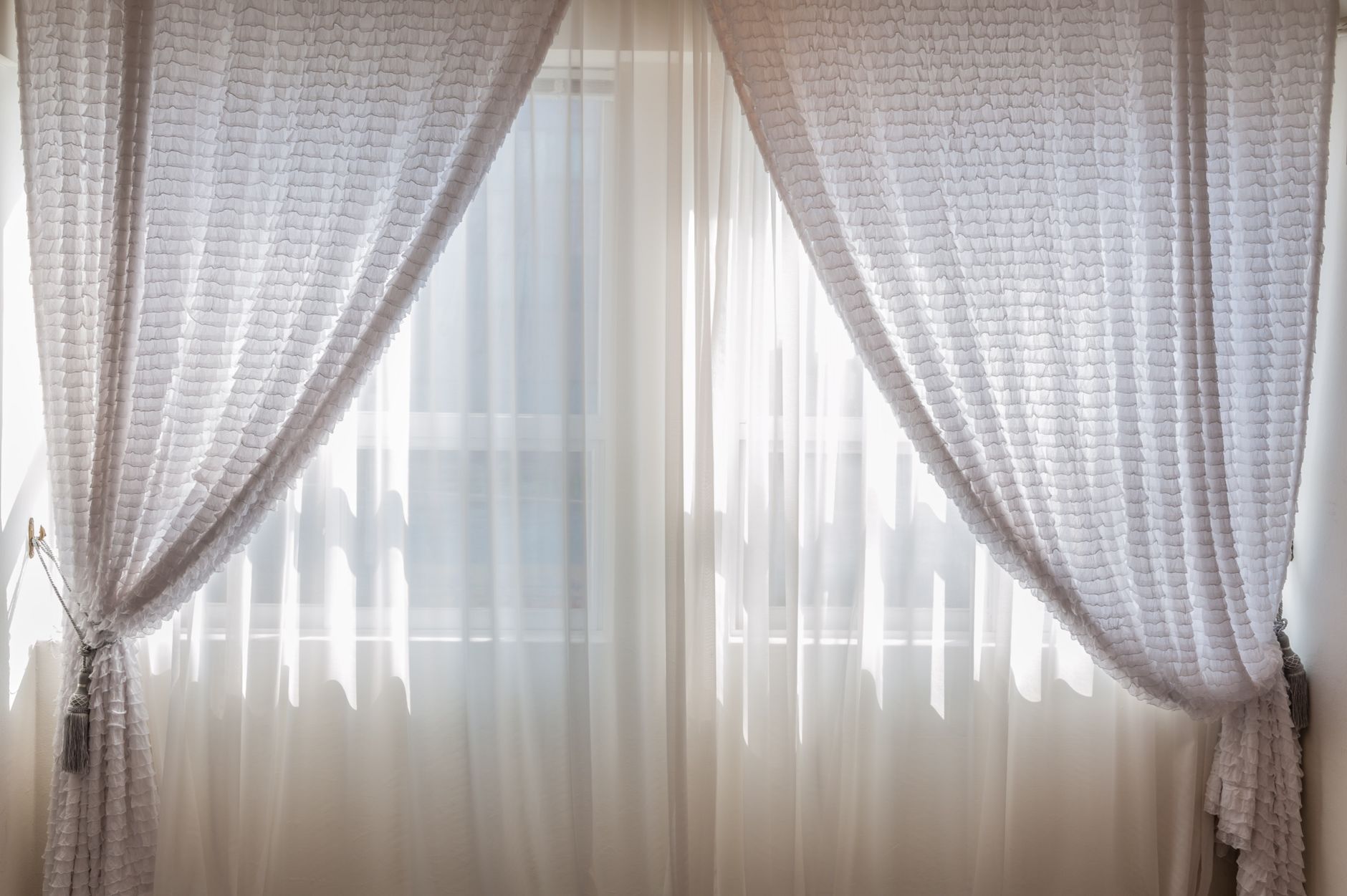 Open window in a kitchen with a gentle breeze, sunlight streaming in, symbolizing good ventilation
