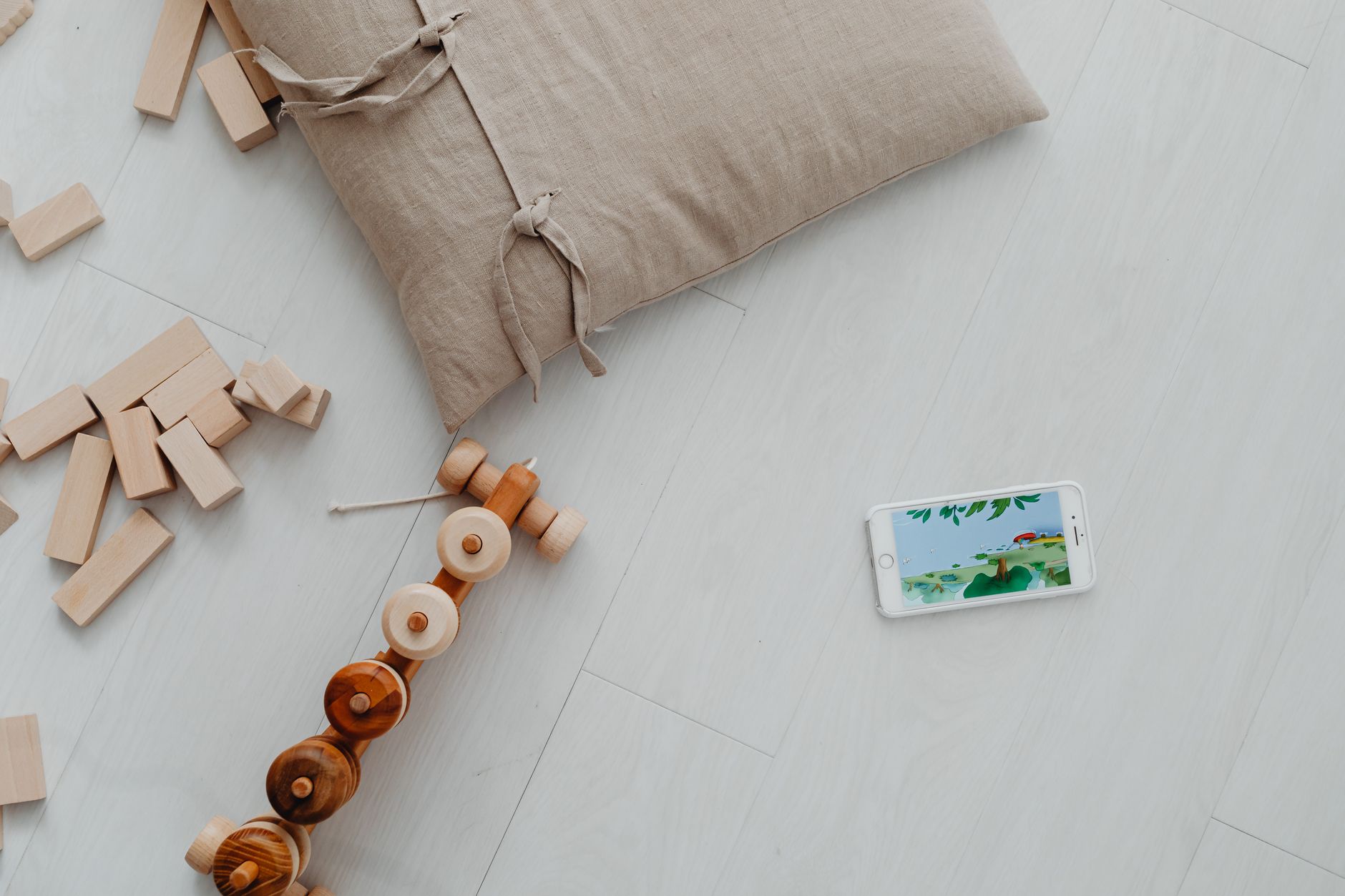 A calm nursery with a white-noise machine, a soft rug, and a baby monitor glowing faintly