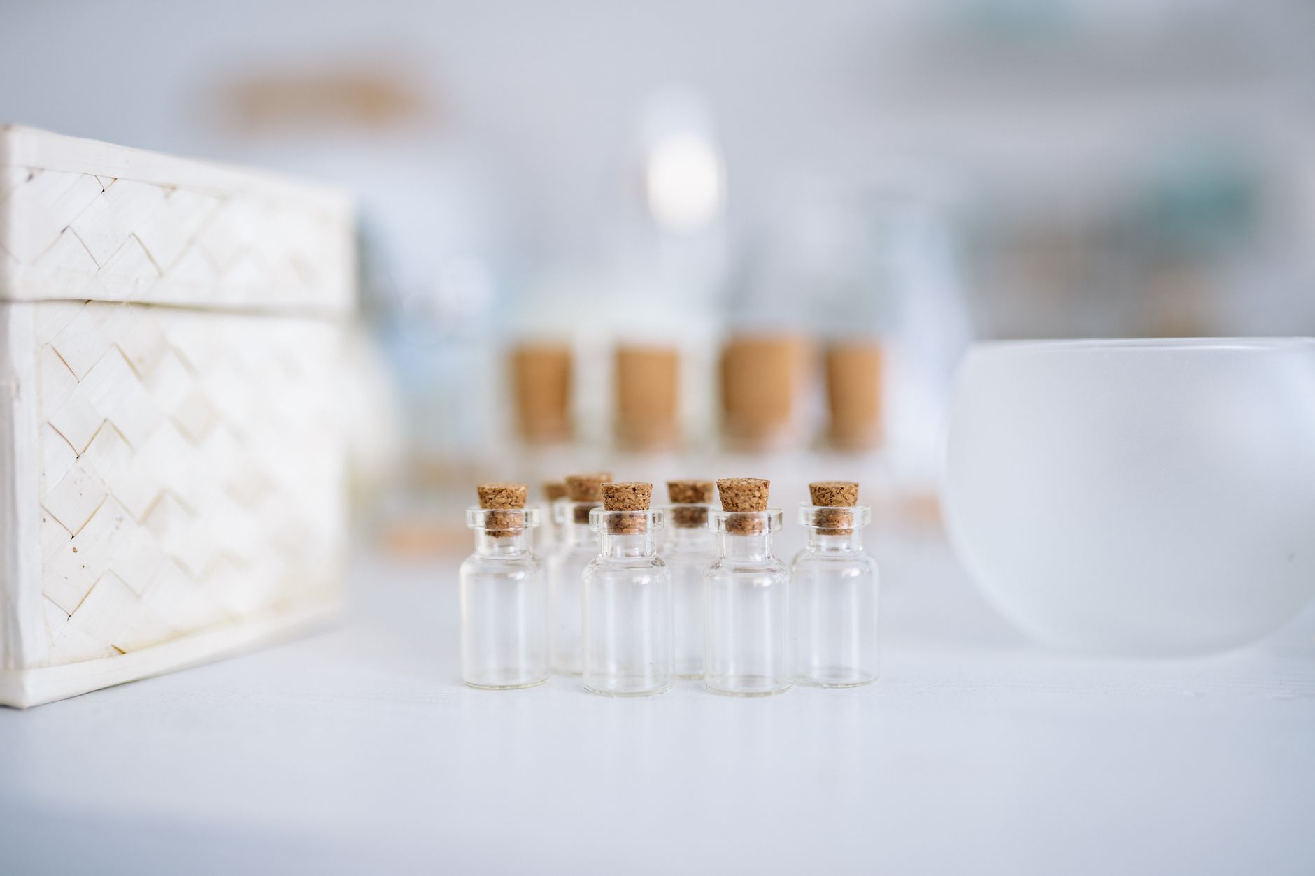 A collection of different eye‑drop bottles including Pataday, Alaway, and artificial tears arranged on a clean white surface, soft shadows emphasizing product diversity