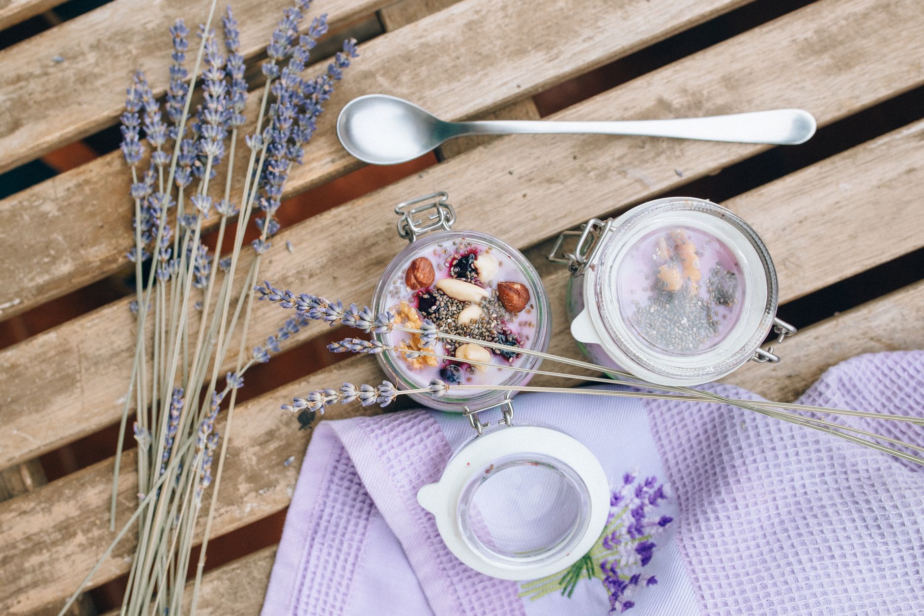 a bowl of chia seed pudding topped with fresh berries, bright daylight highlighting the creamy texture and colorful fruit