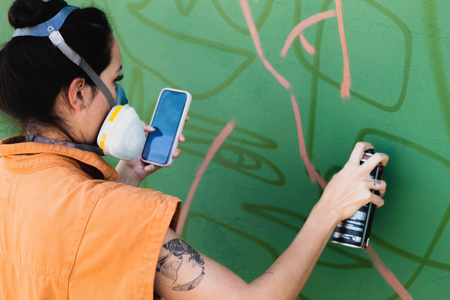 a clear label showing a zero‑VOC paint can next to a pregnant woman holding a respirator, highlighting safe painting choices, 100 characters
