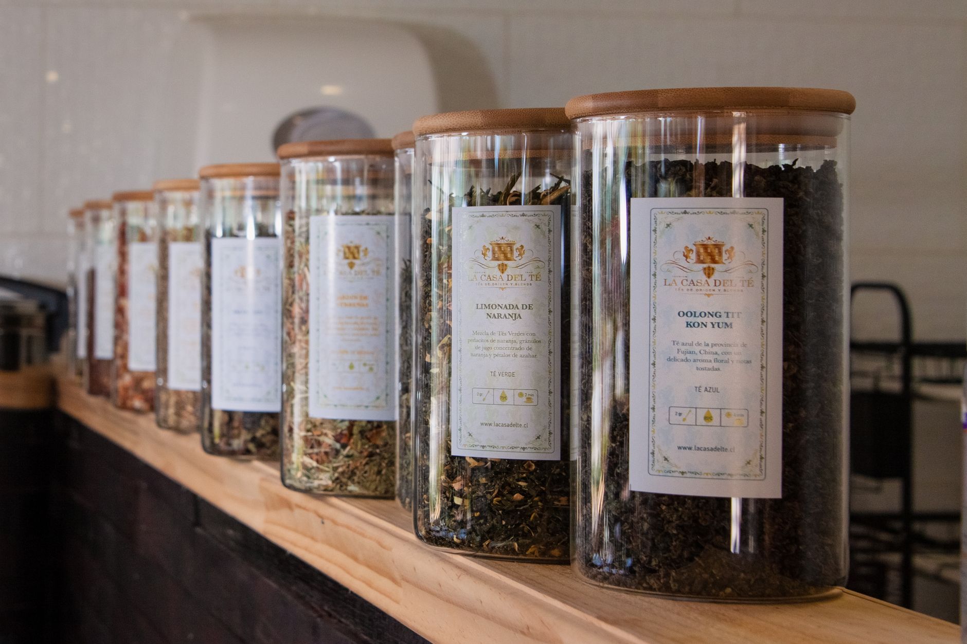 a comparison of herbal tea bags on a shelf, highlighting safe options like rooibos, ginger, peppermint, and lemon balm for pregnant women