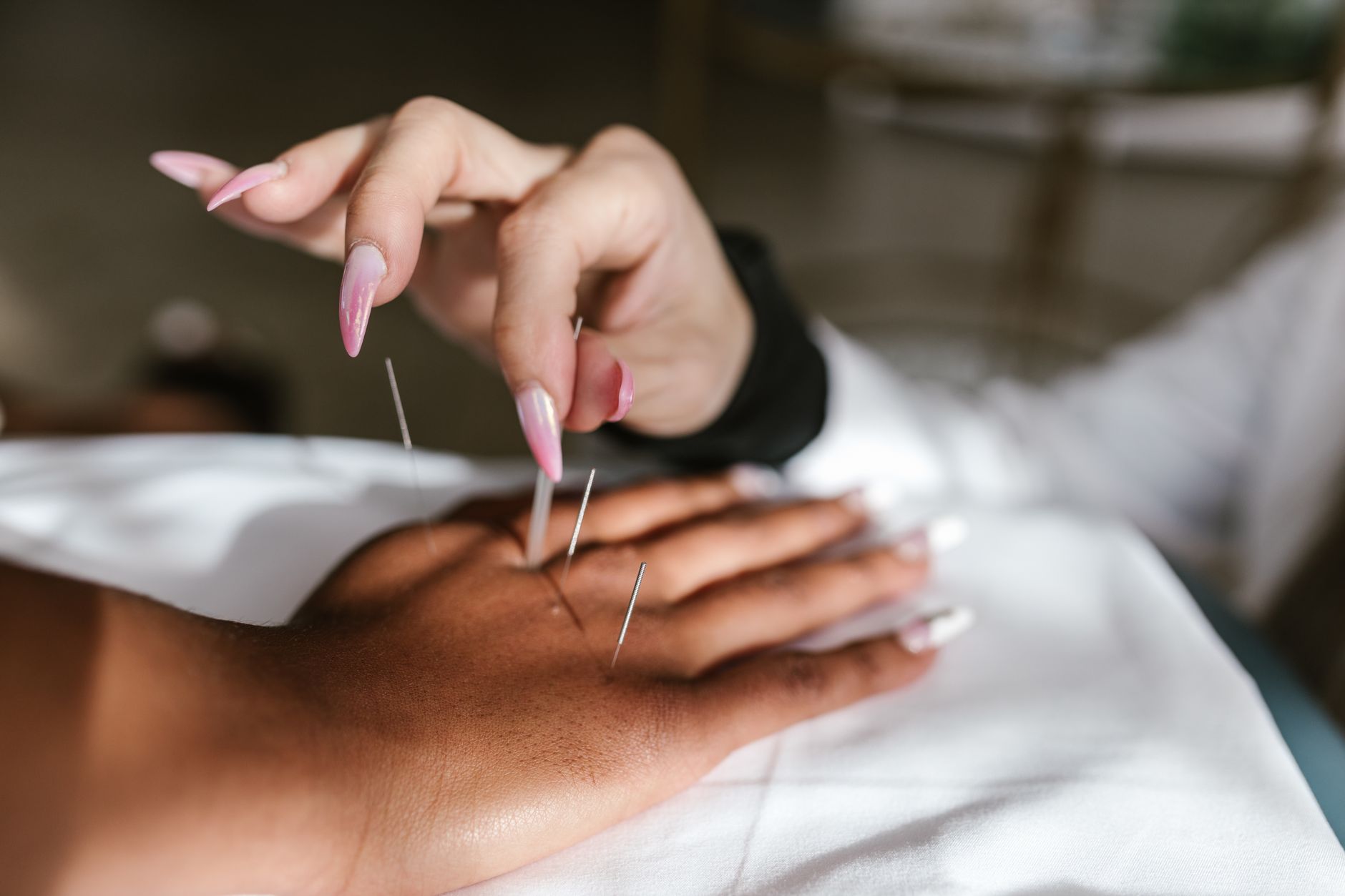 A comparison table of pregnancy-safe energy therapies with icons for each: acupuncture needles, a chiropractor adjusting a spine, reflexology feet, a massage therapist's hands, a Tai Chi practitioner in slow motion, and a woman meditating with eyes closed