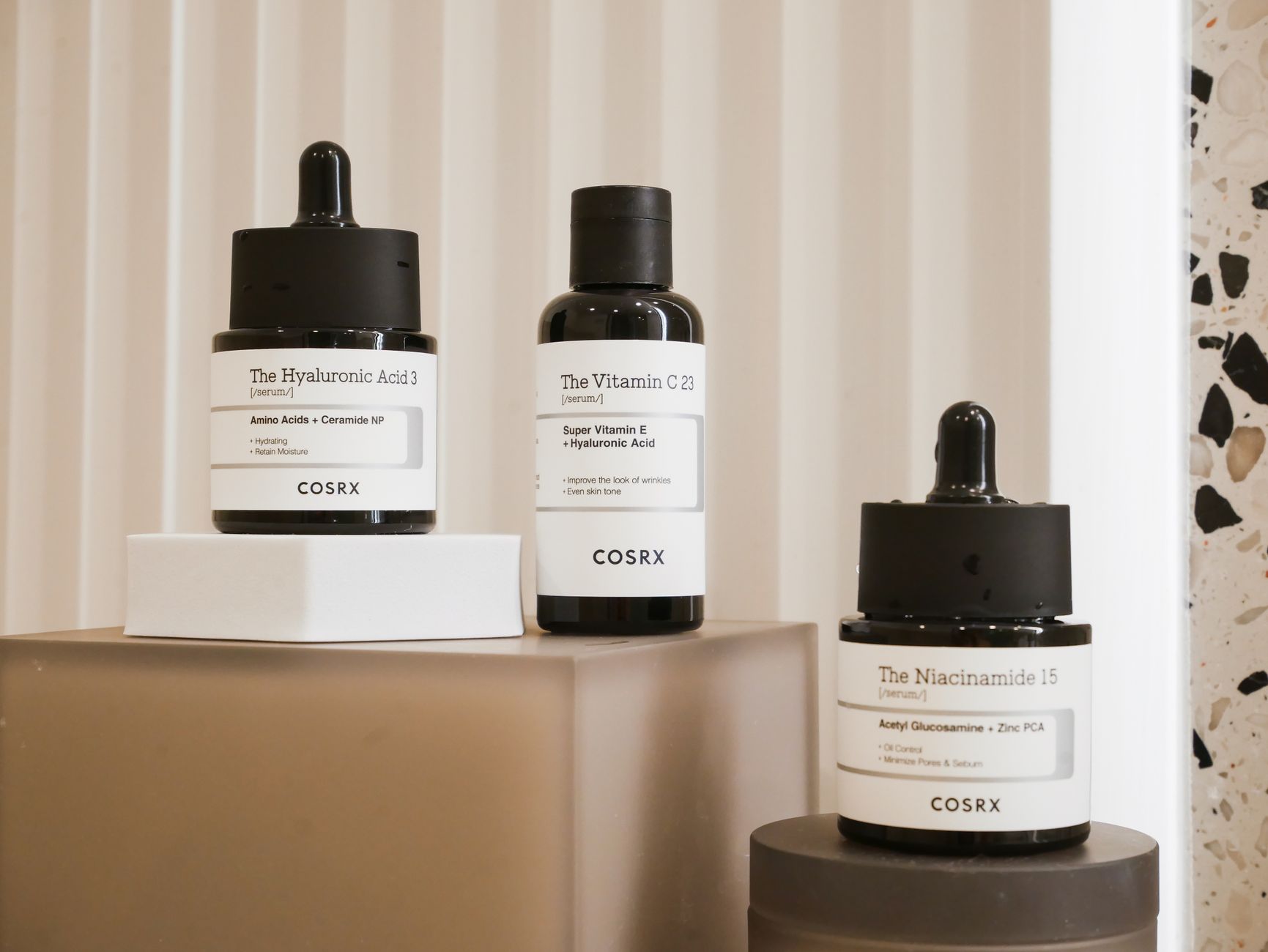 a calm bathroom shelf displaying pregnancy‑safe skincare bottles, including vitamin C, niacinamide, and hyaluronic acid, with soft morning light