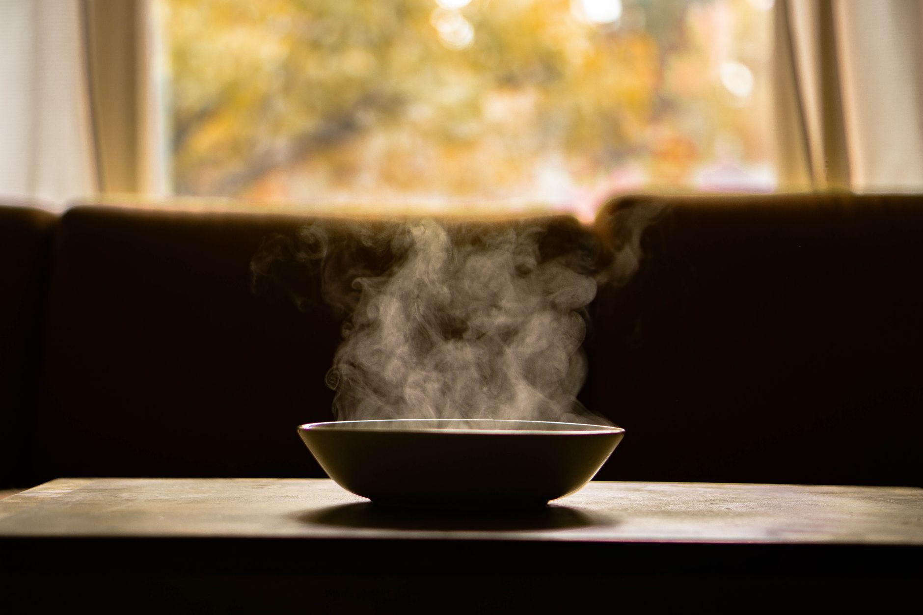 steam rising from a bowl of hot water on a kitchen counter, illustrating a natural congestion remedy for pregnant women