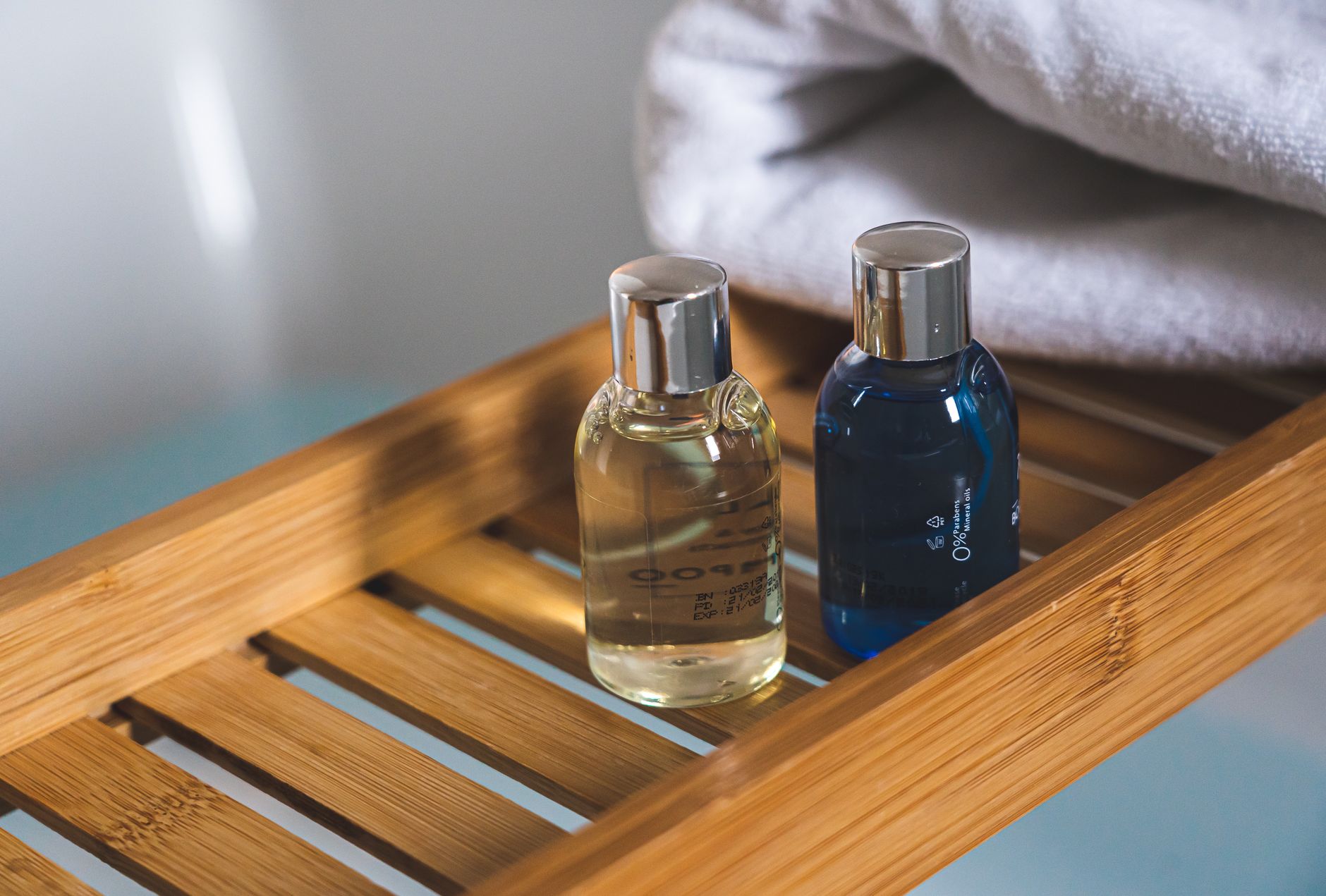 wooden tray with sulfate-free personal care products including shampoo, soap, and toothpaste