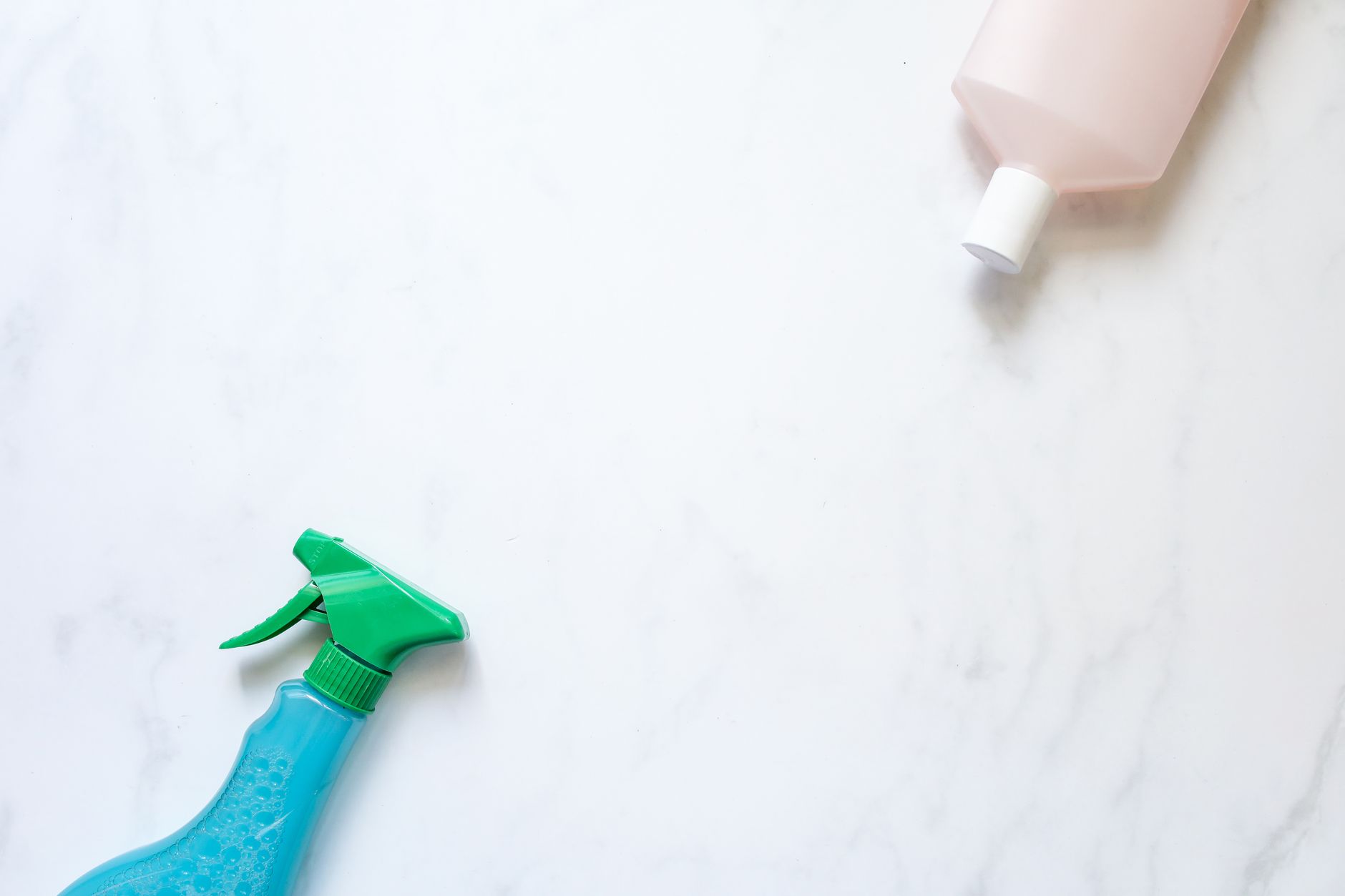 A Vicks VapoInhaler and a bottle of saline nasal spray on a white bathroom counter