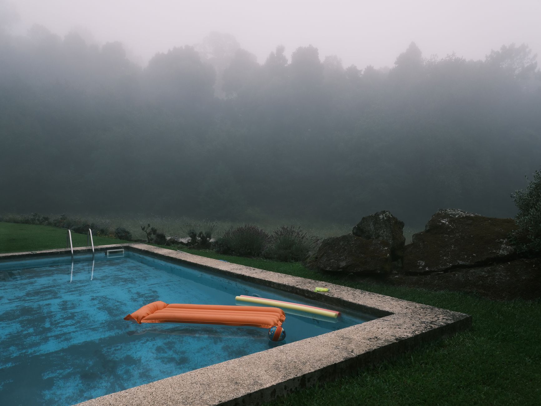 peaceful indoor pool with a floating pool noodle, gentle lighting, a pregnant woman relaxing on the noodle, soft water ripples