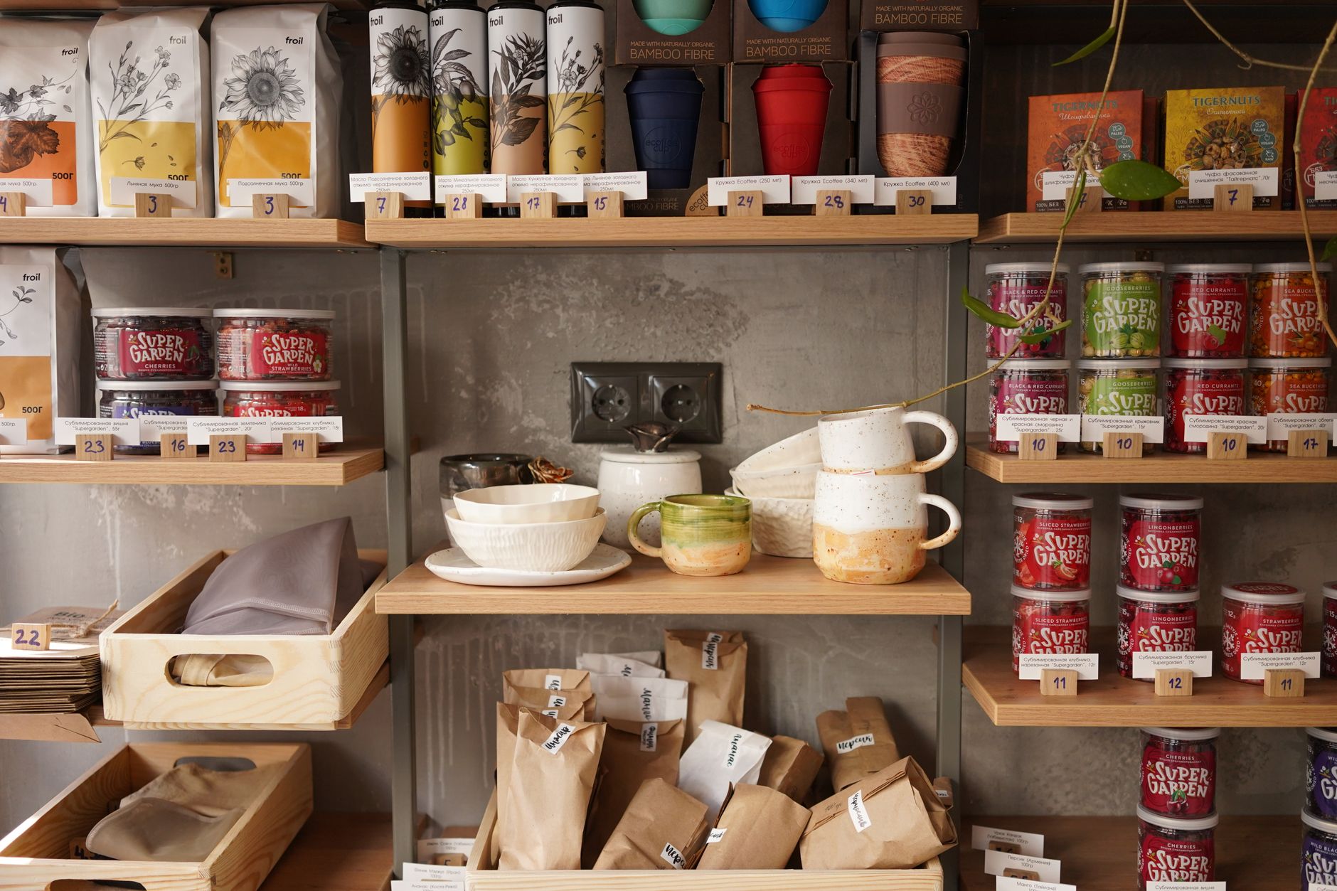 A tidy kitchen shelf displaying a variety of herbal tea boxes, including Yogi Bedtime Tea, chamomile, and rooibos, highlighting safe options for pregnant people