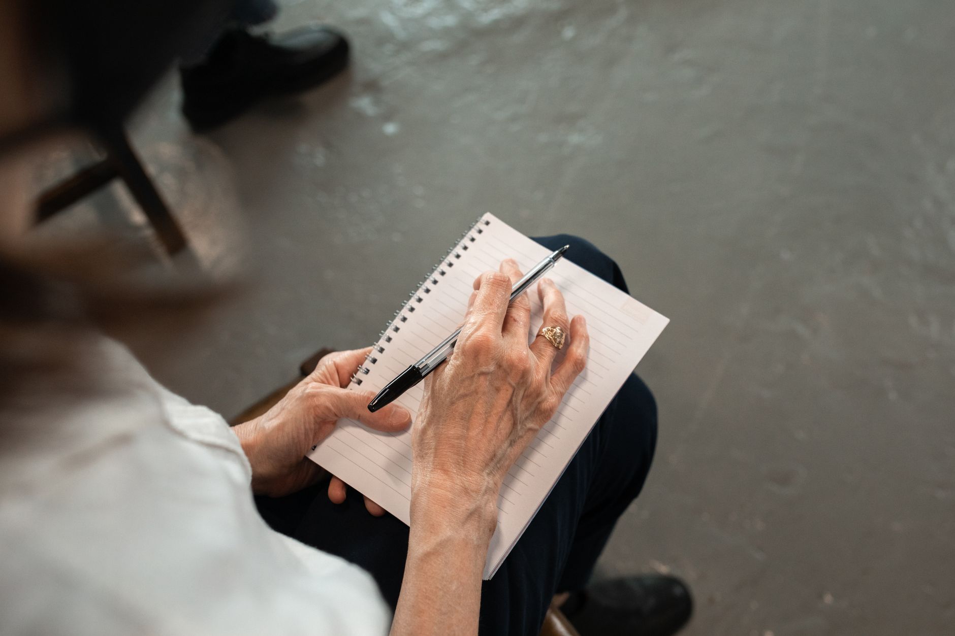 Mom writing in a simple notebook