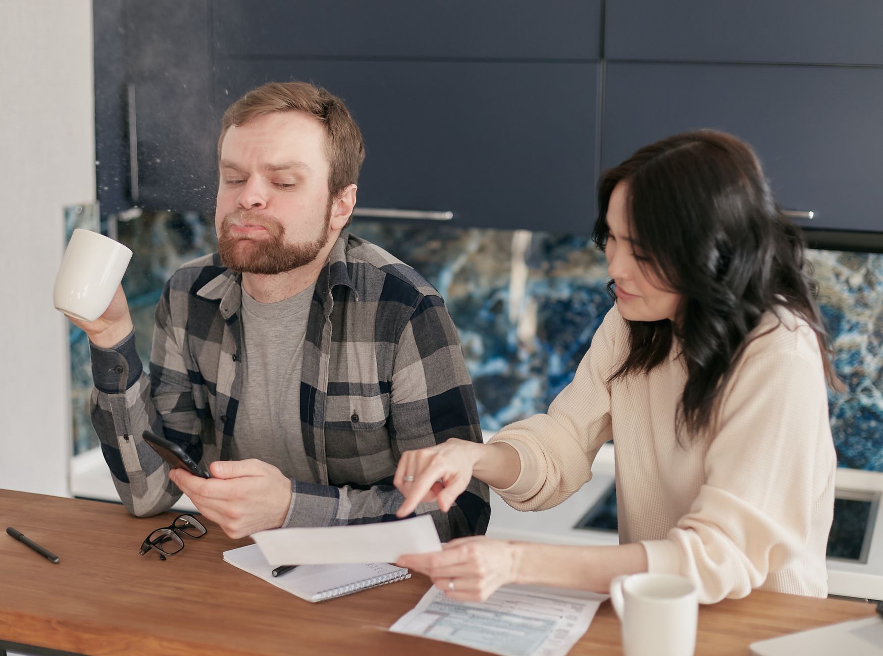 Couple discussing family planning options at a table.