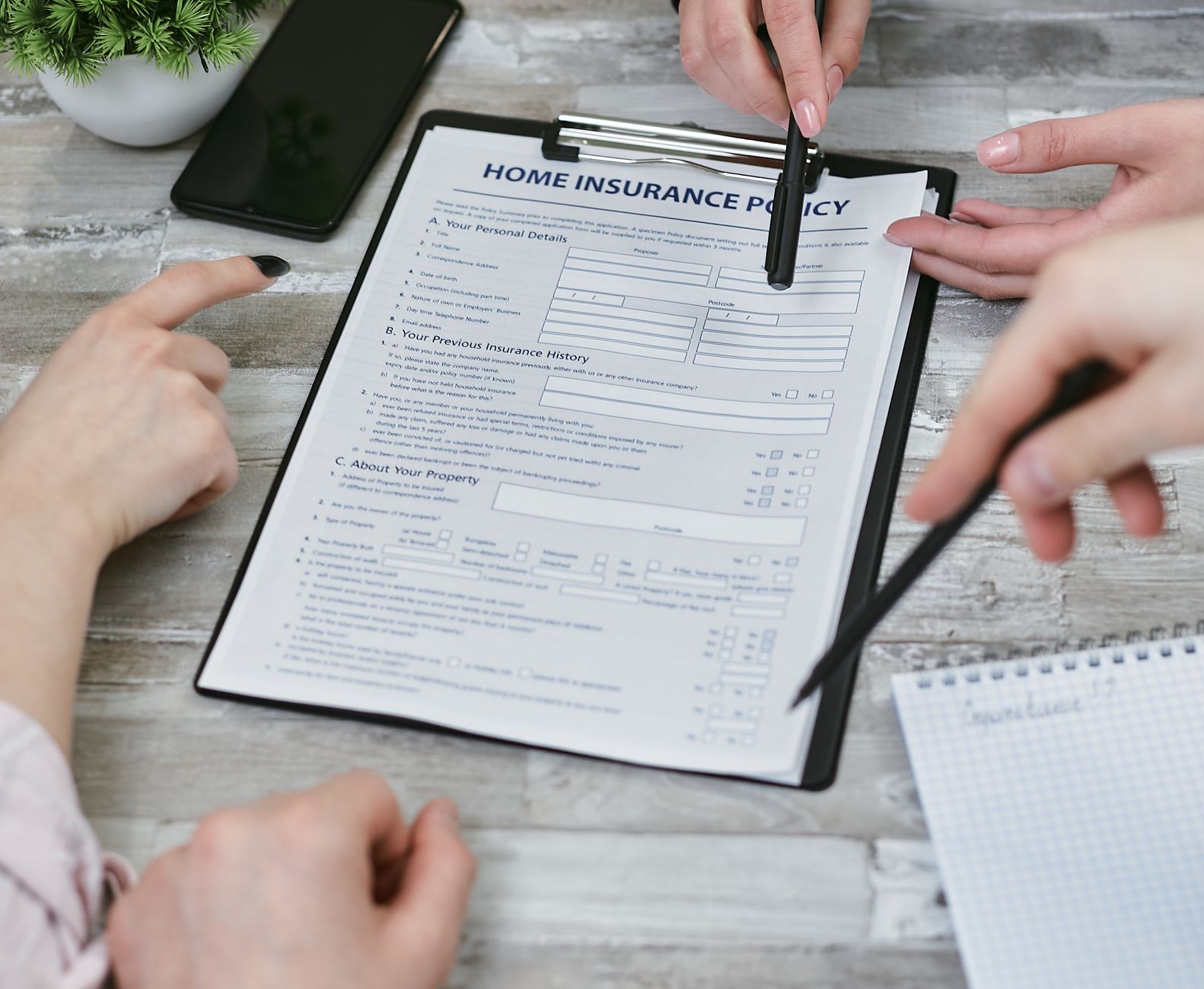 Single parent reviewing insurance paperwork
