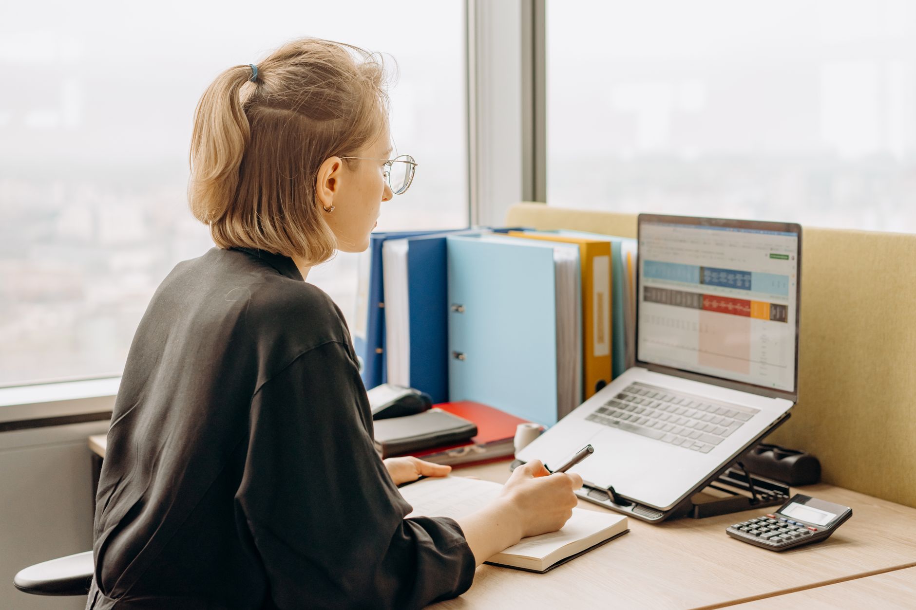 Comparing life insurance quotes on a laptop