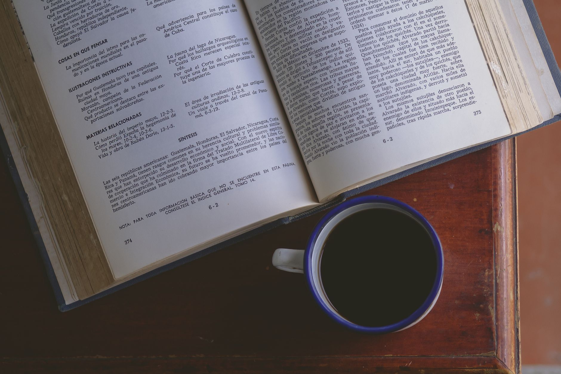 A thoughtful man reviewing a printed semen analysis report at a kitchen table, coffee mug nearby, soft morning light