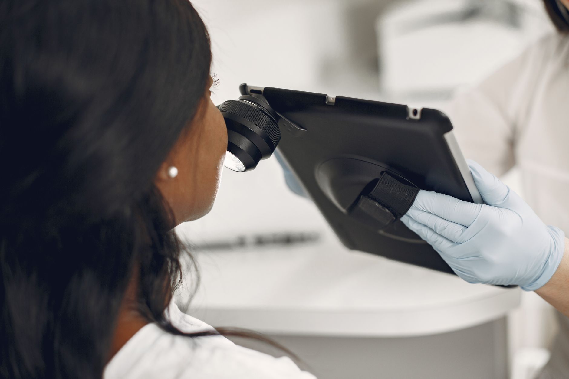 Close-up of a doctor's hand gently examining a pregnant woman's cheek for skin changes, with a soft, reassuring interaction, professional and caring, natural light